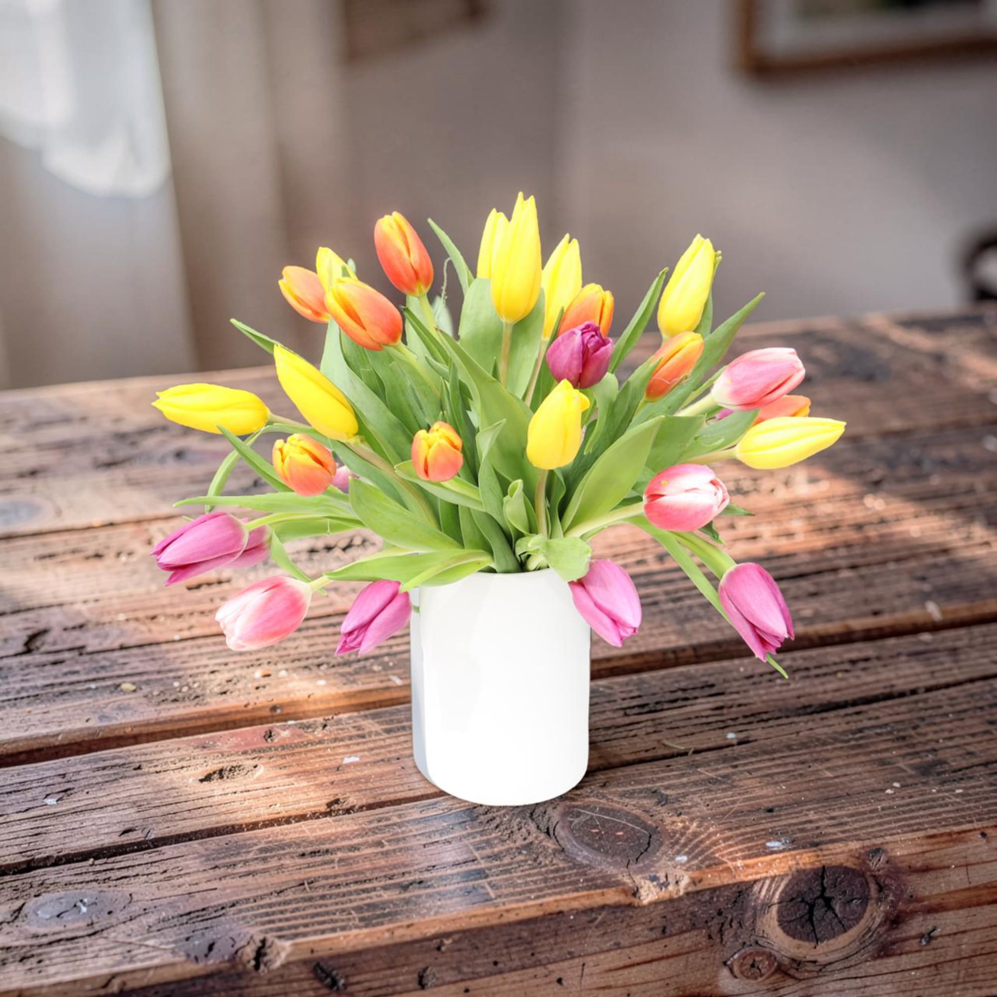 A lively cascade of yellow, pink, orange and soft purple tulips creates, photo 4 of 4