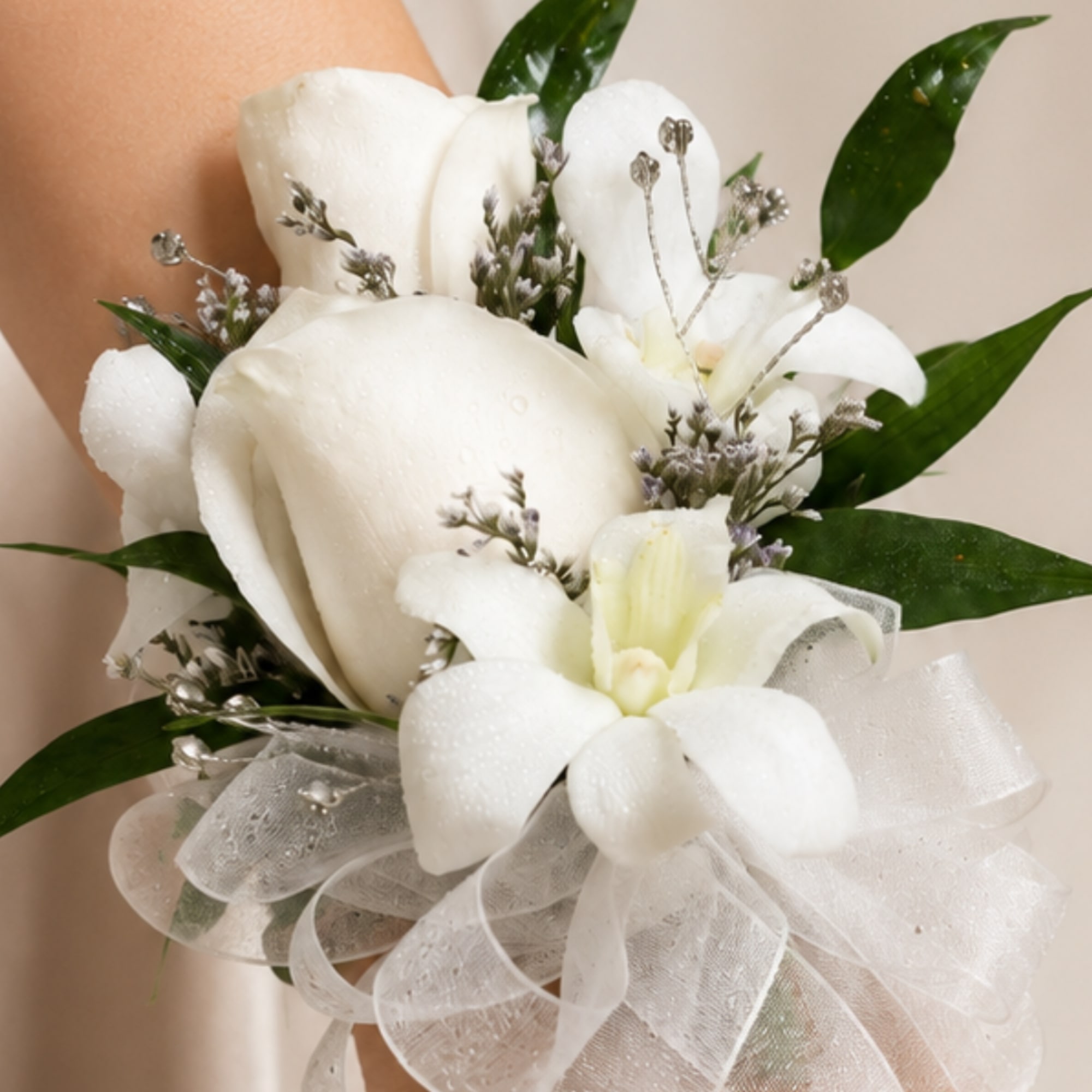White calla lily bouquet with sheer ribbon and green leaves