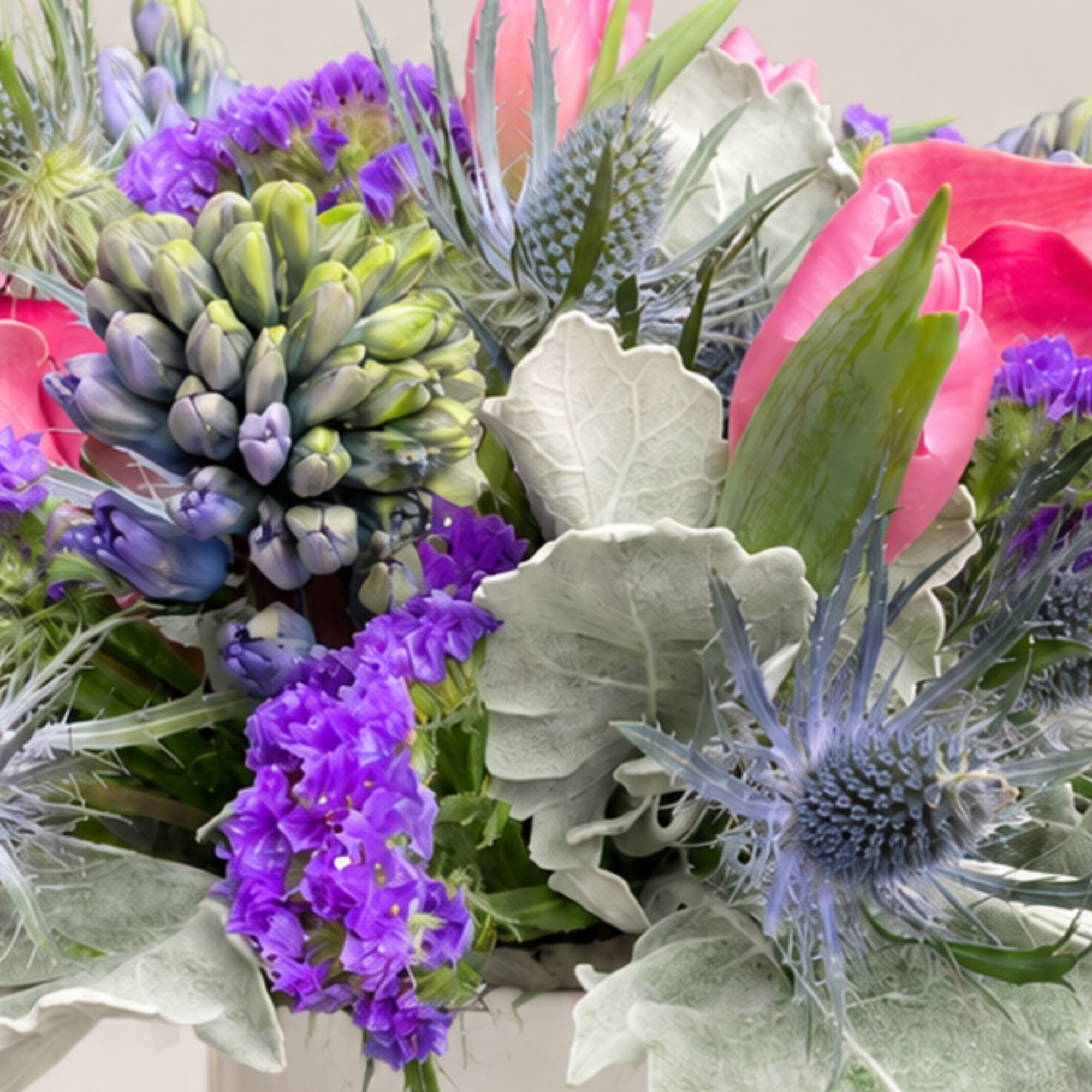 Mixed bouquet with purple and pink blooms in a vase
