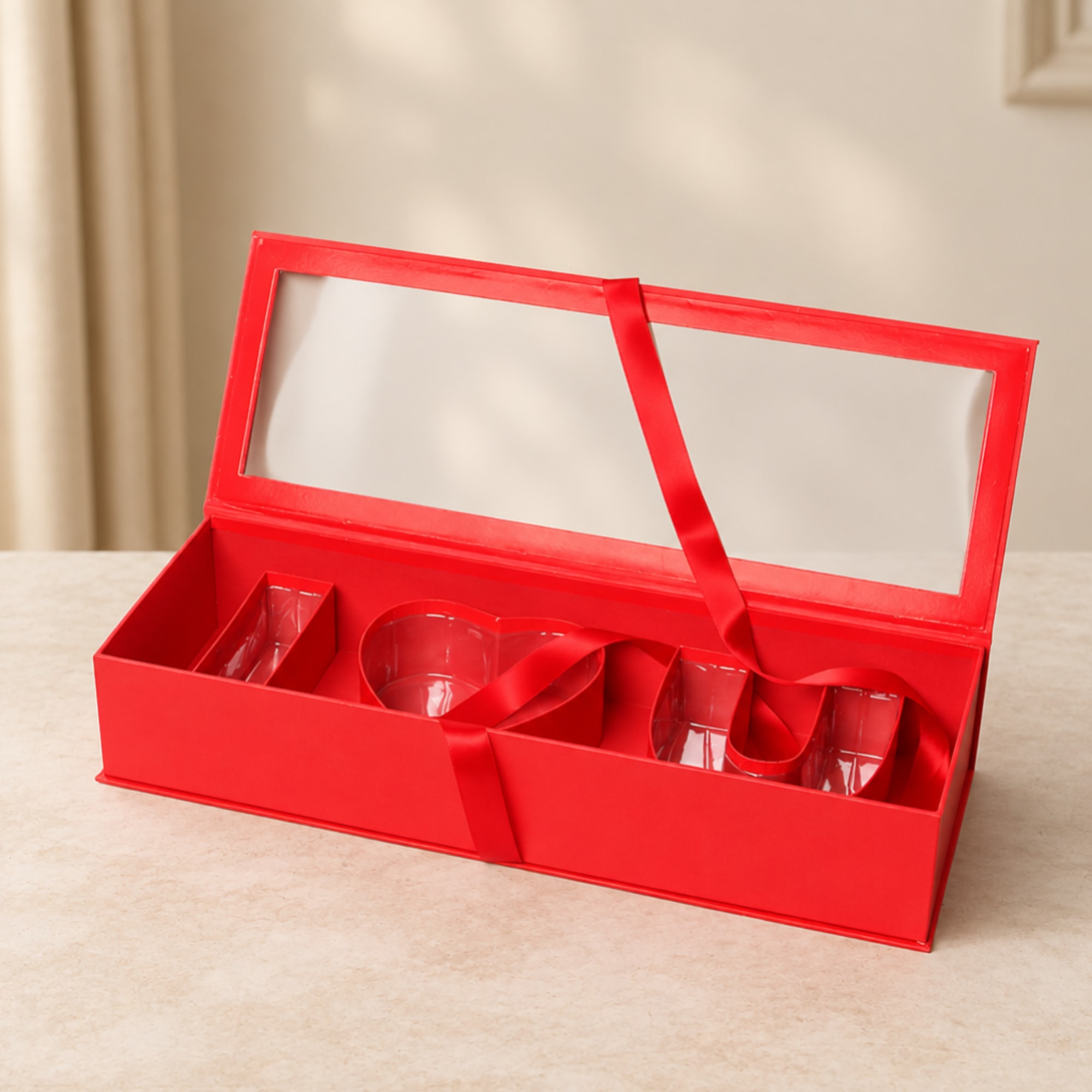 Red gift box with clear window lid and ribbon compartments