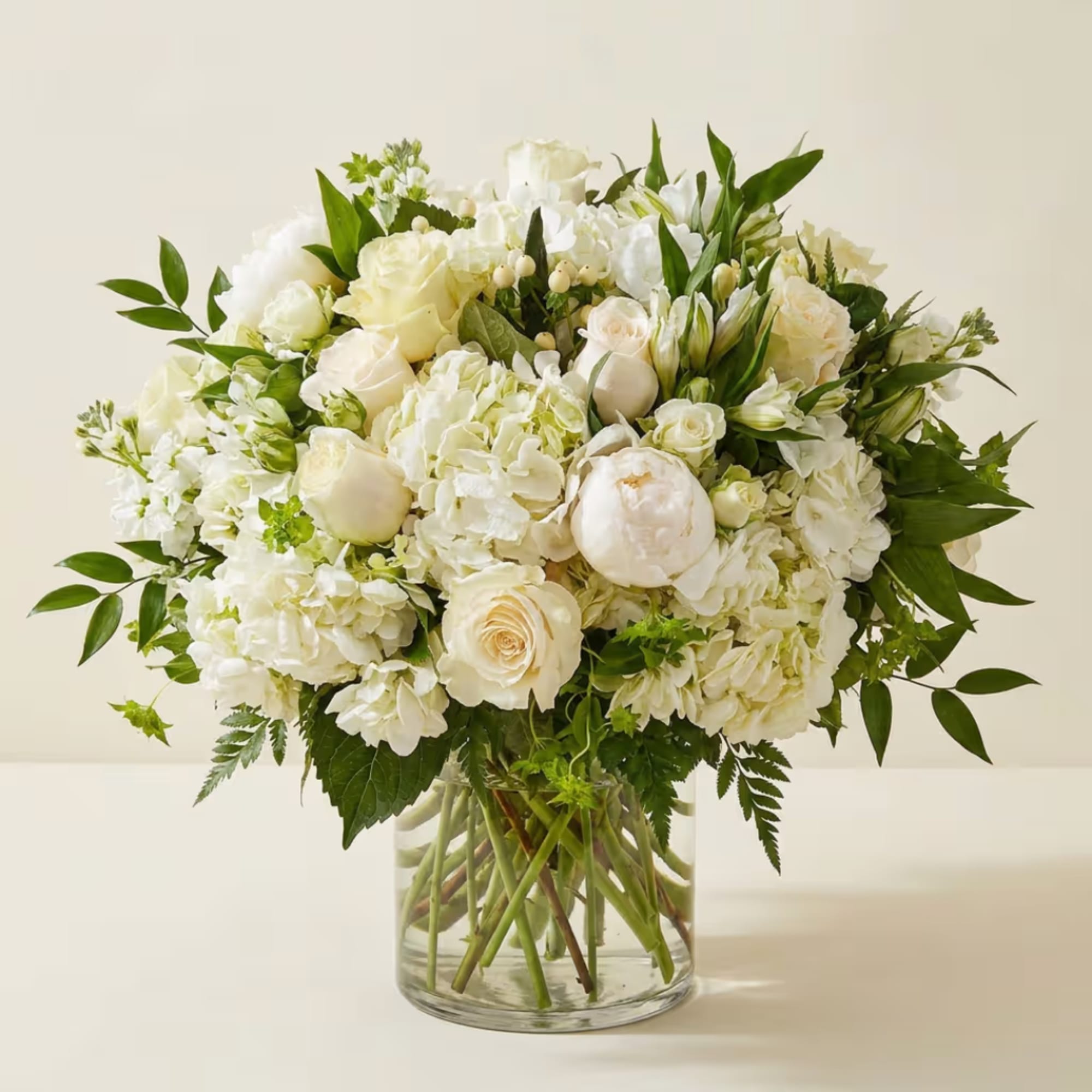White floral arrangement in a clear glass vase