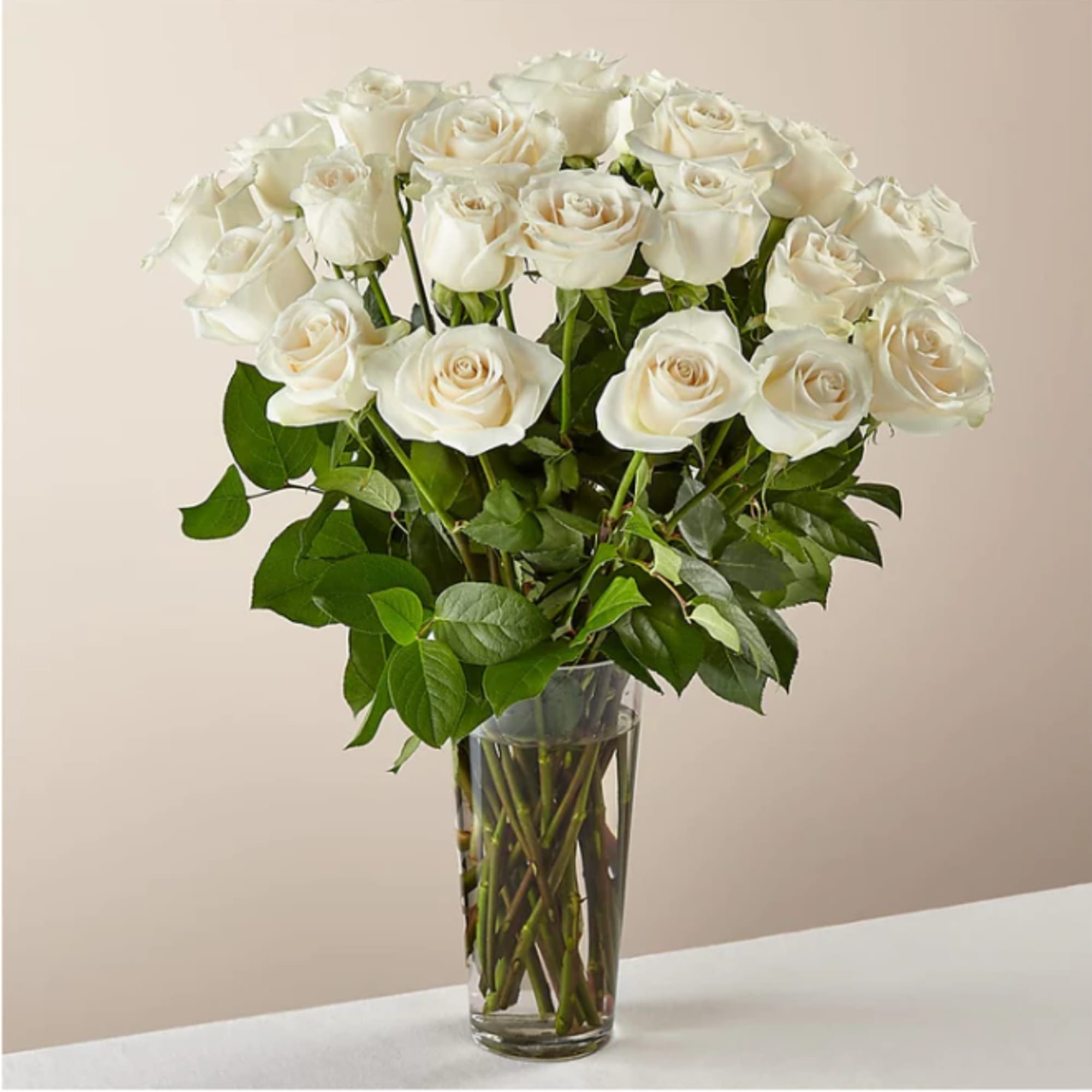 Bouquet of white roses in a clear glass vase