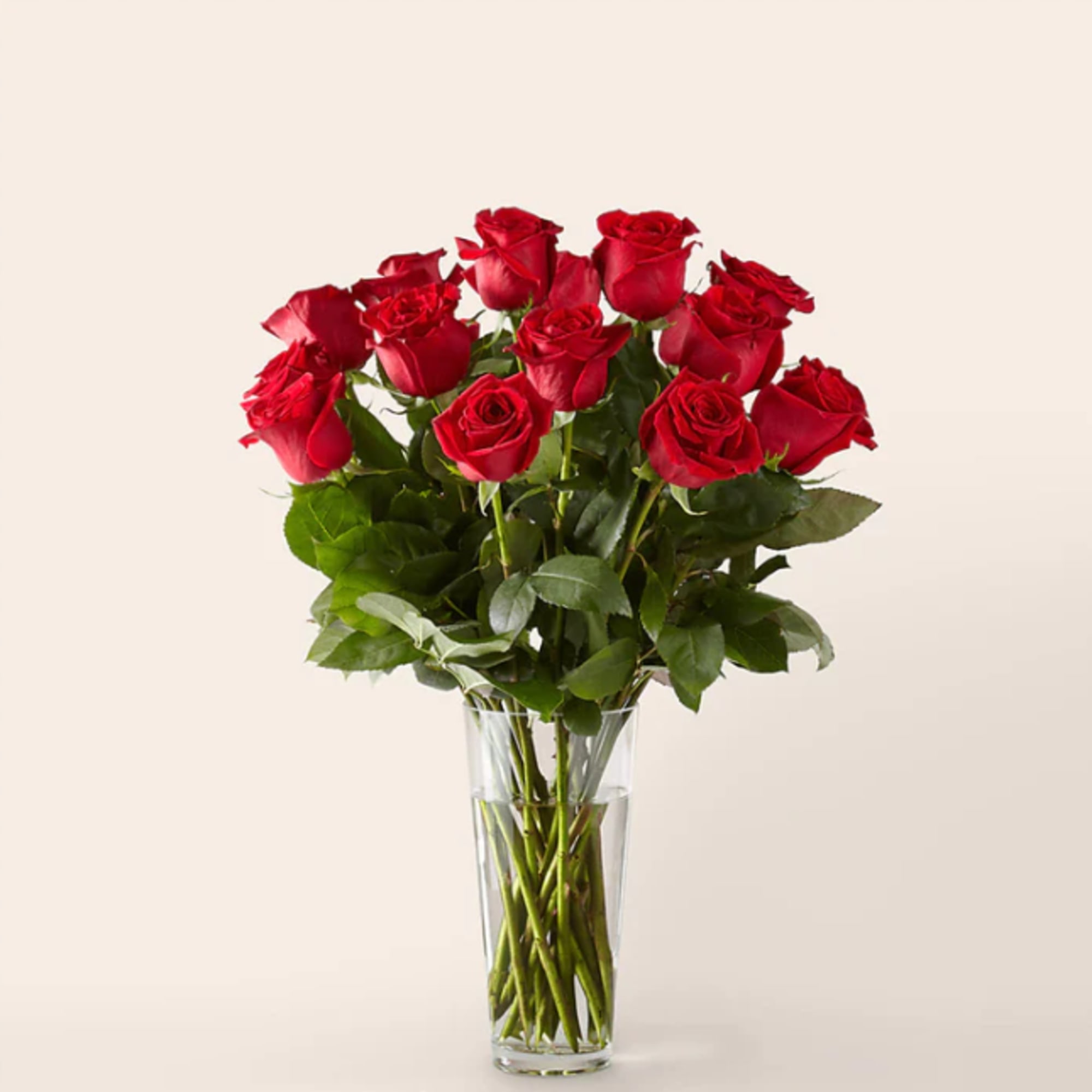 Bouquet of red roses in a clear glass vase