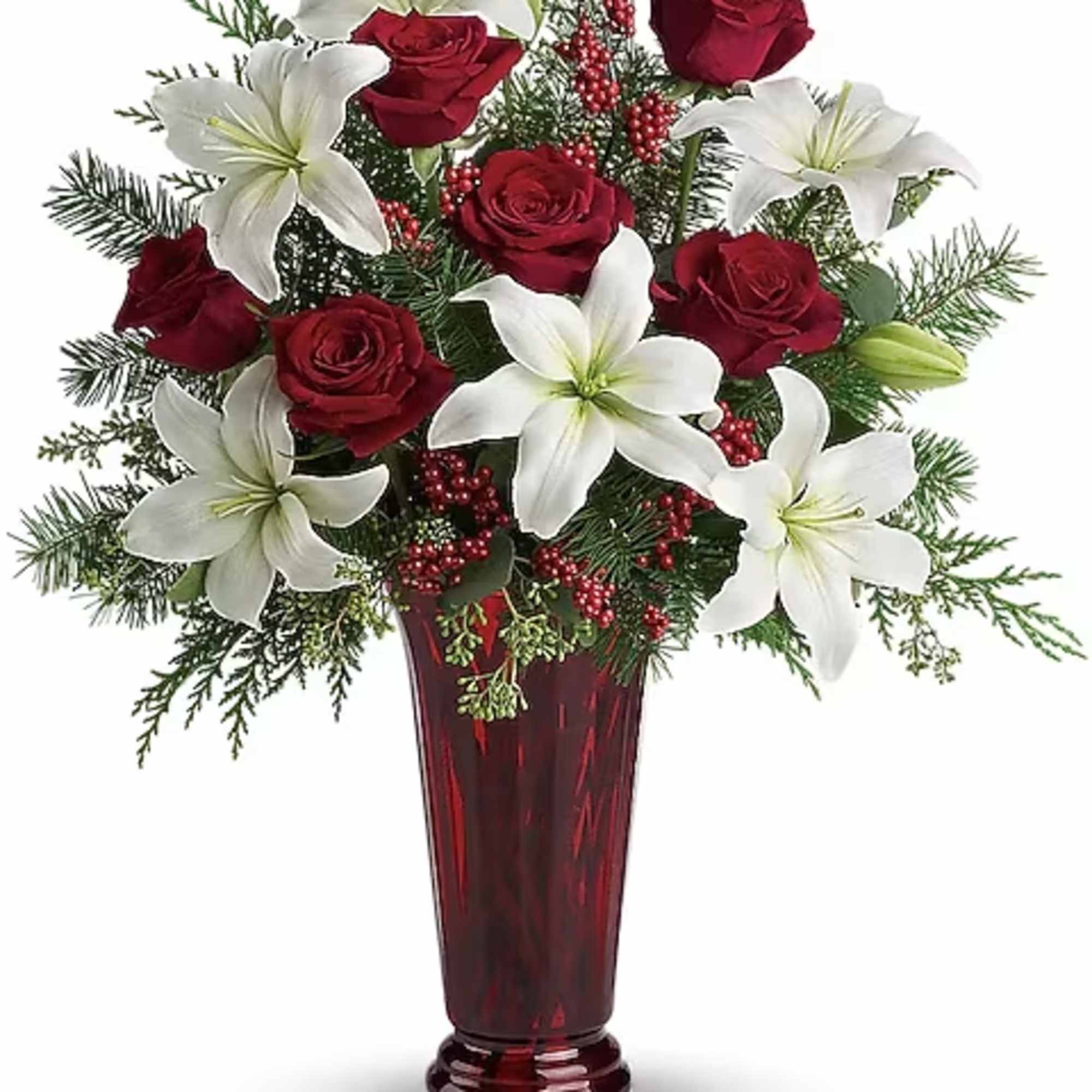 Red roses and white lilies arranged in a tall red vase