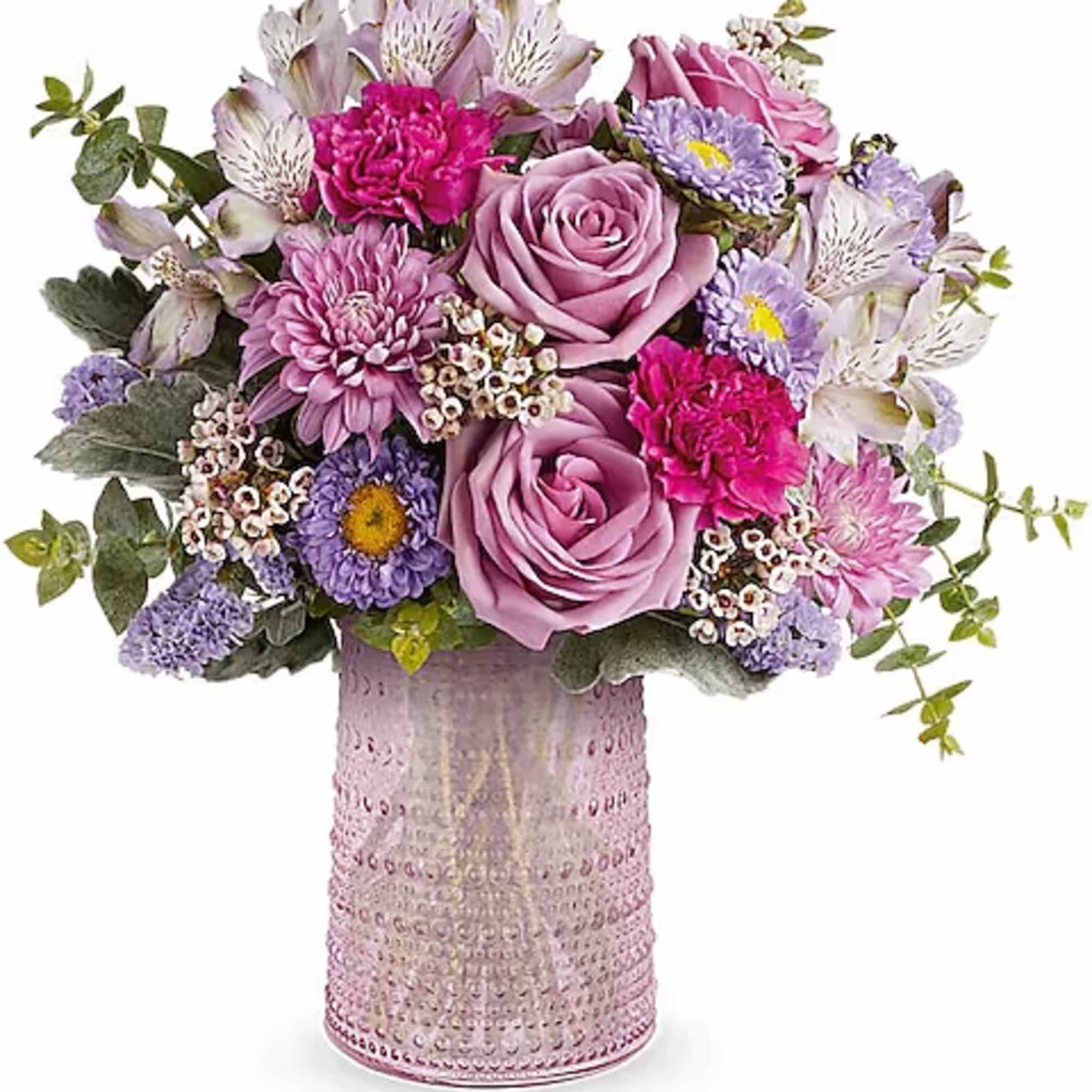 Pink and lavender mixed bouquet in a textured glass vase