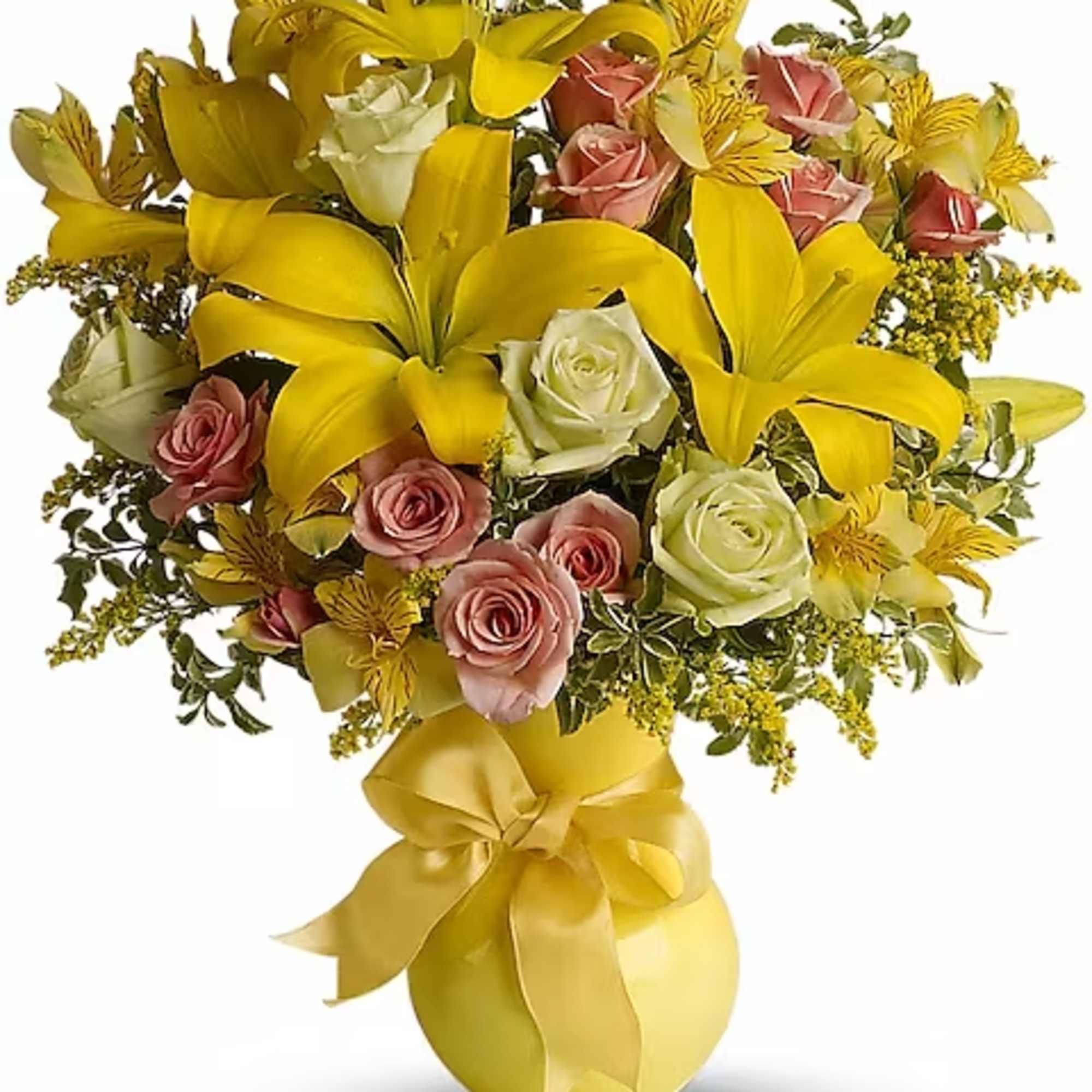 Yellow lilies and pink roses in a gold vase with a ribbon bow