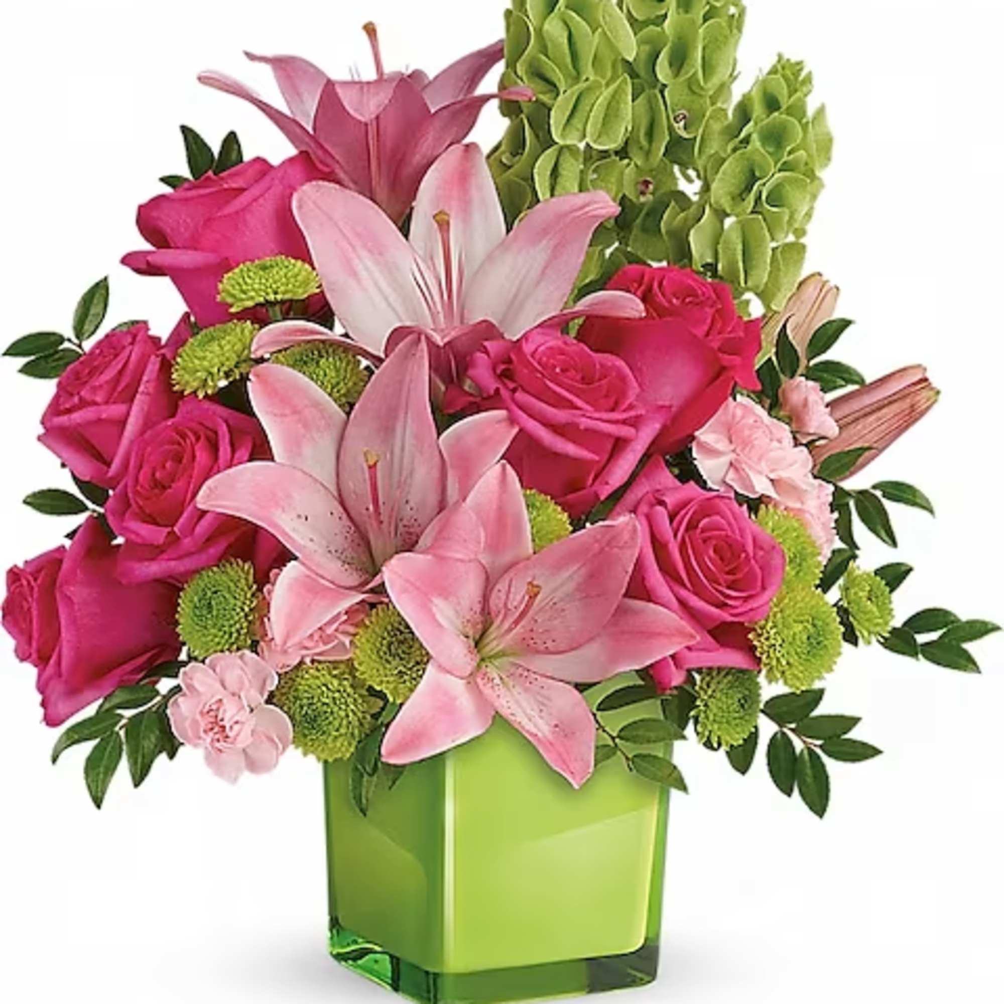 Pink roses and lilies arranged in a green glass vase
