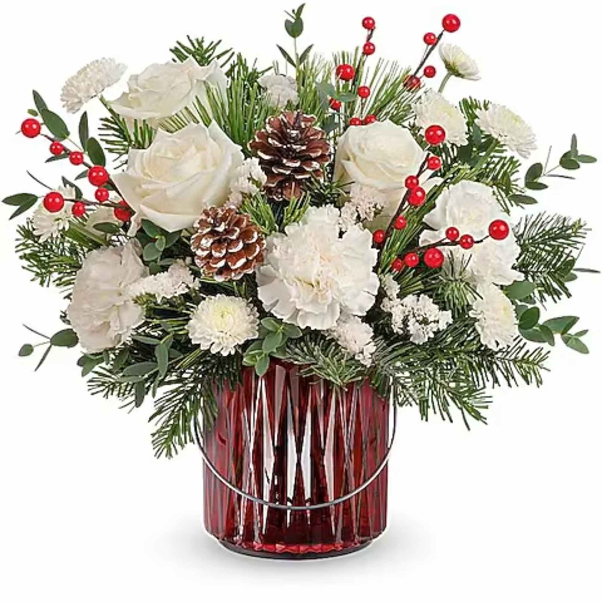 White roses and carnations in a red glass vase with pinecones and red berries