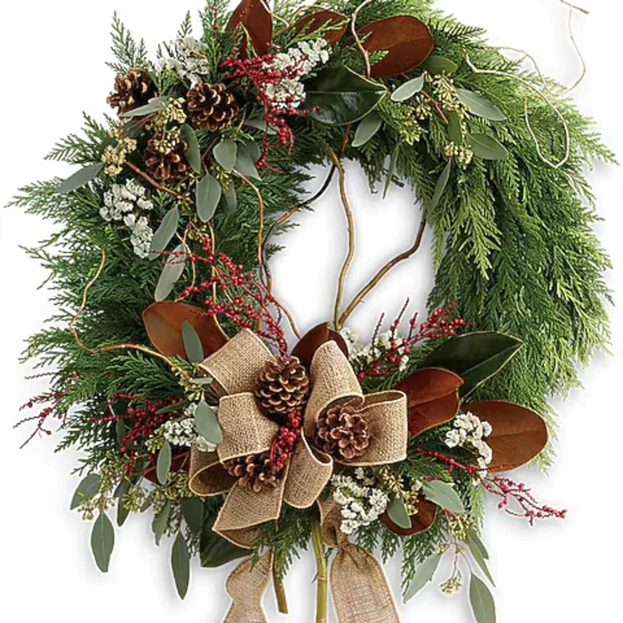 Holiday wreath with pinecones, berries, and burlap ribbon