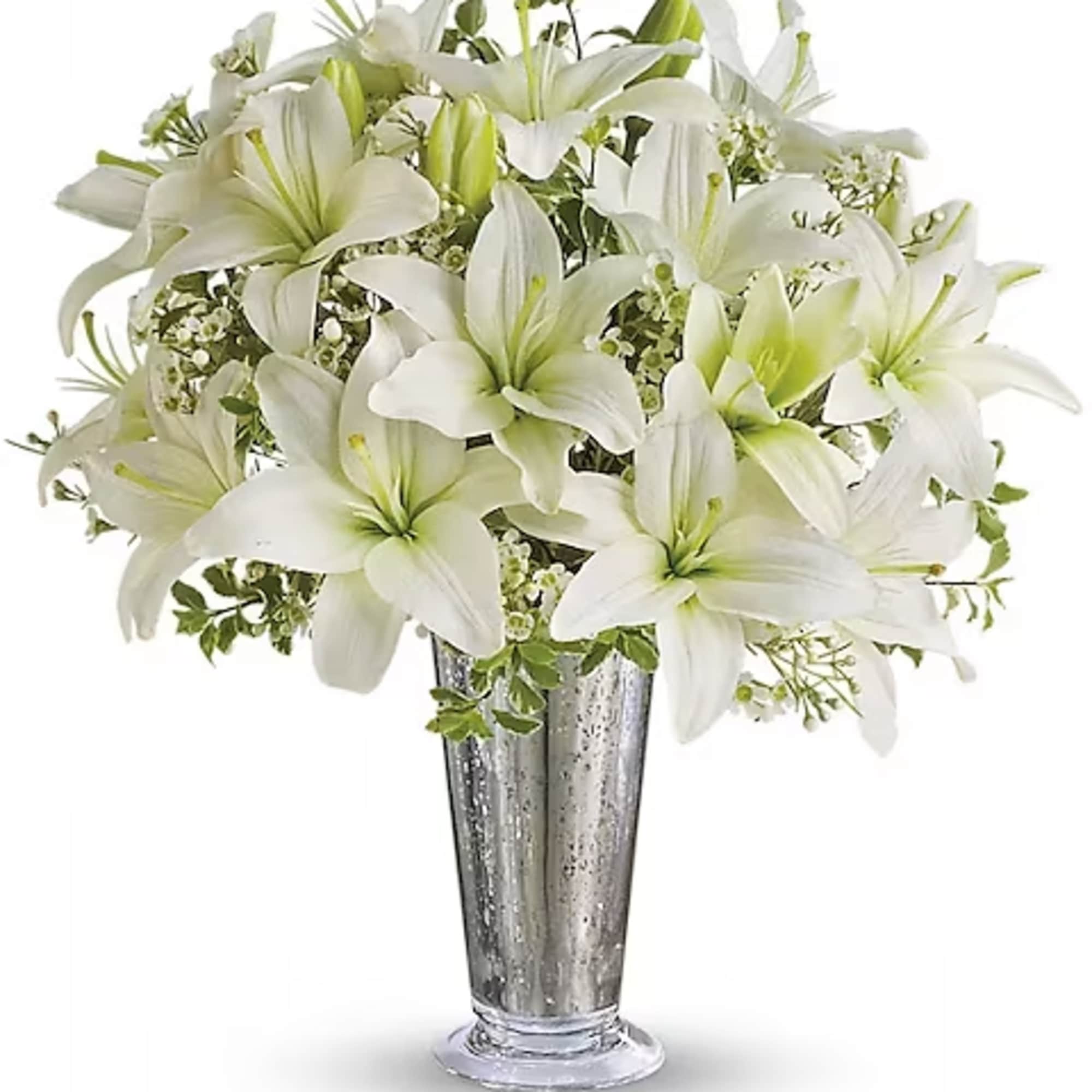 White lilies arranged in a tall silver vase