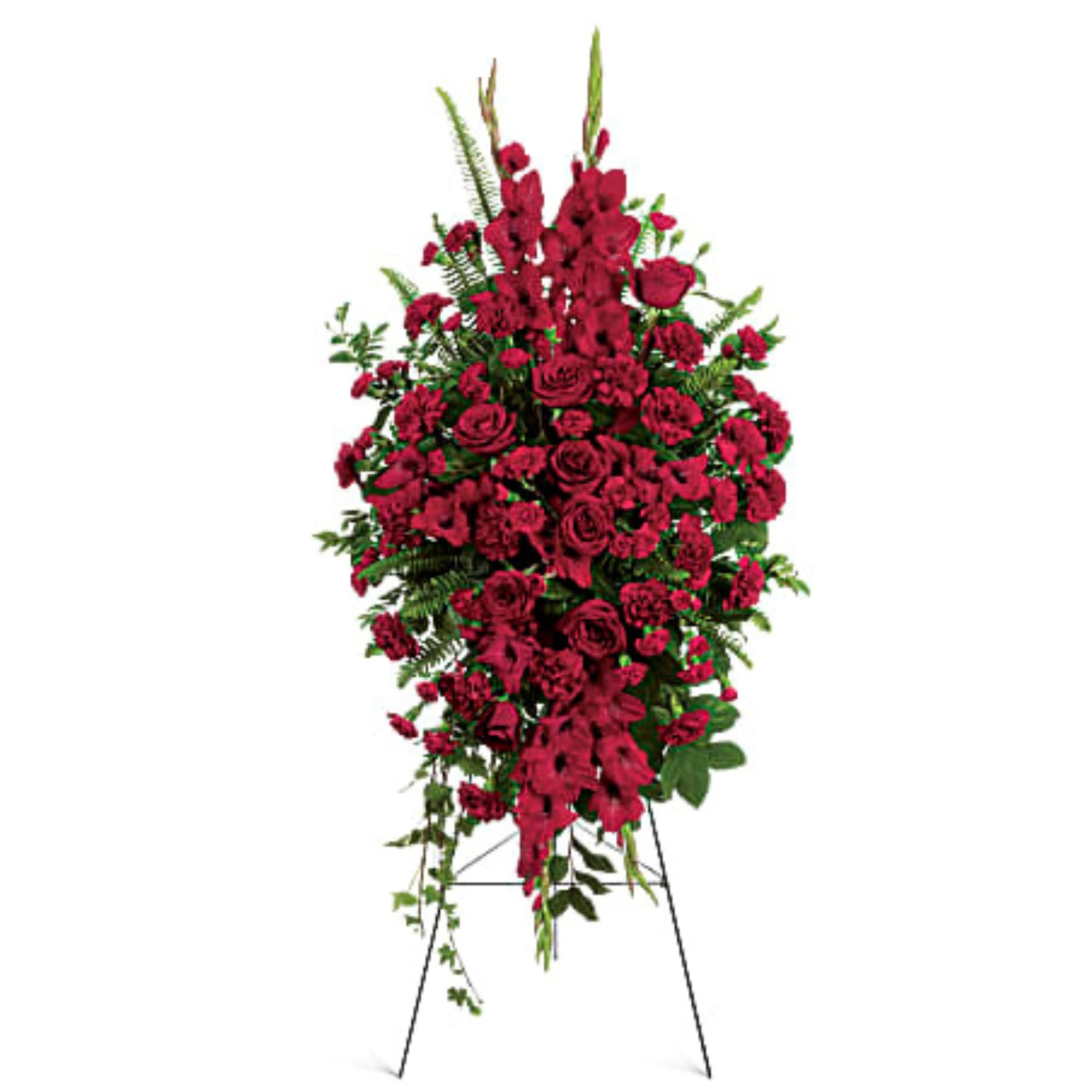 Tall standing spray of red roses and carnations on an easel