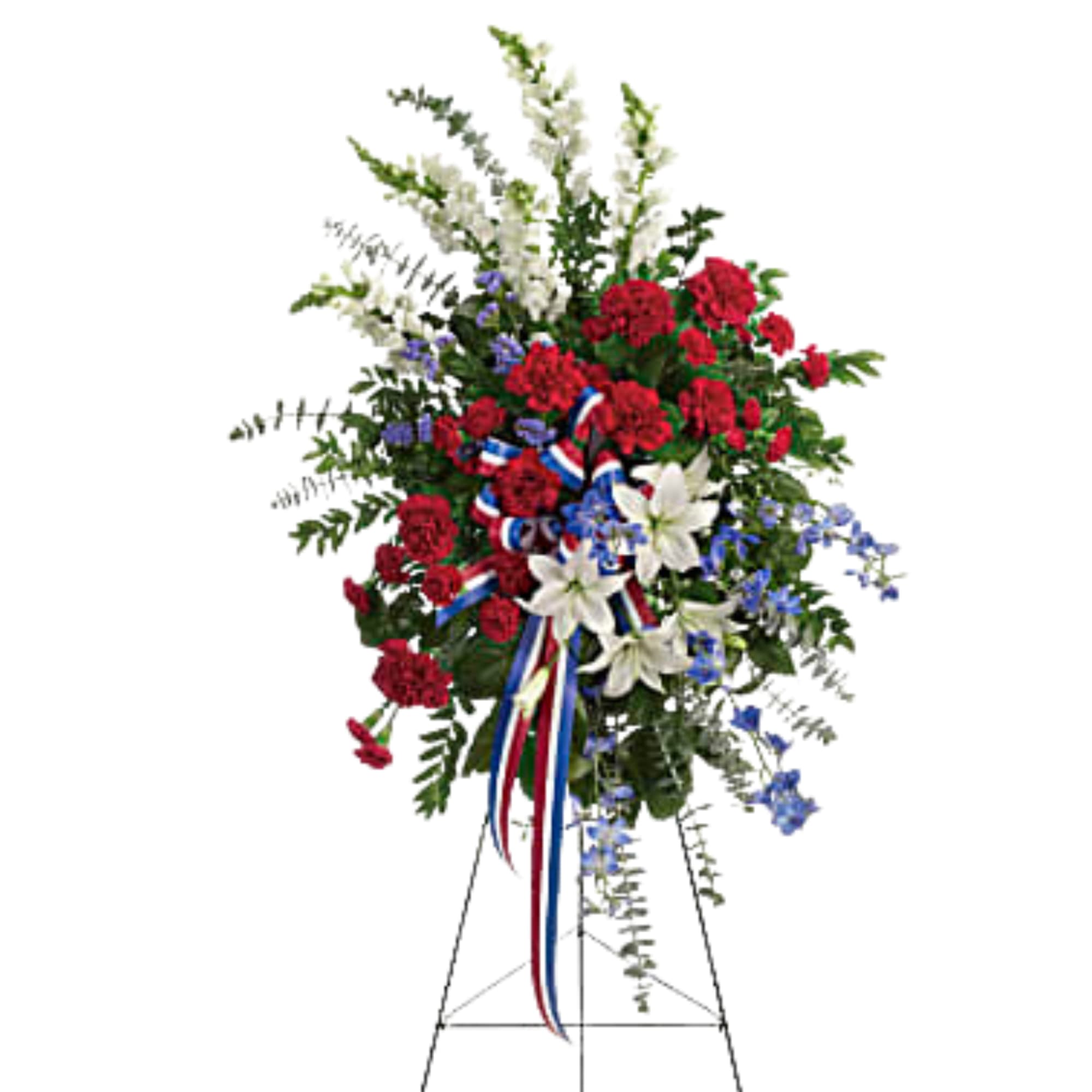Standing floral spray with red, white, and blue flowers on an easel