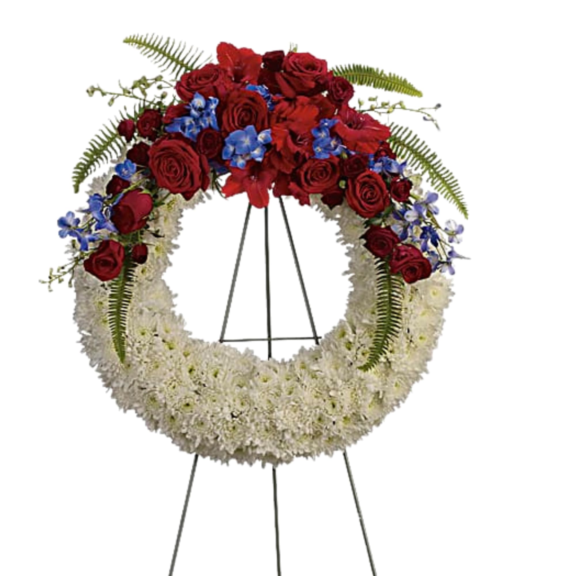 Circular funeral wreath with red roses and white flowers on a stand