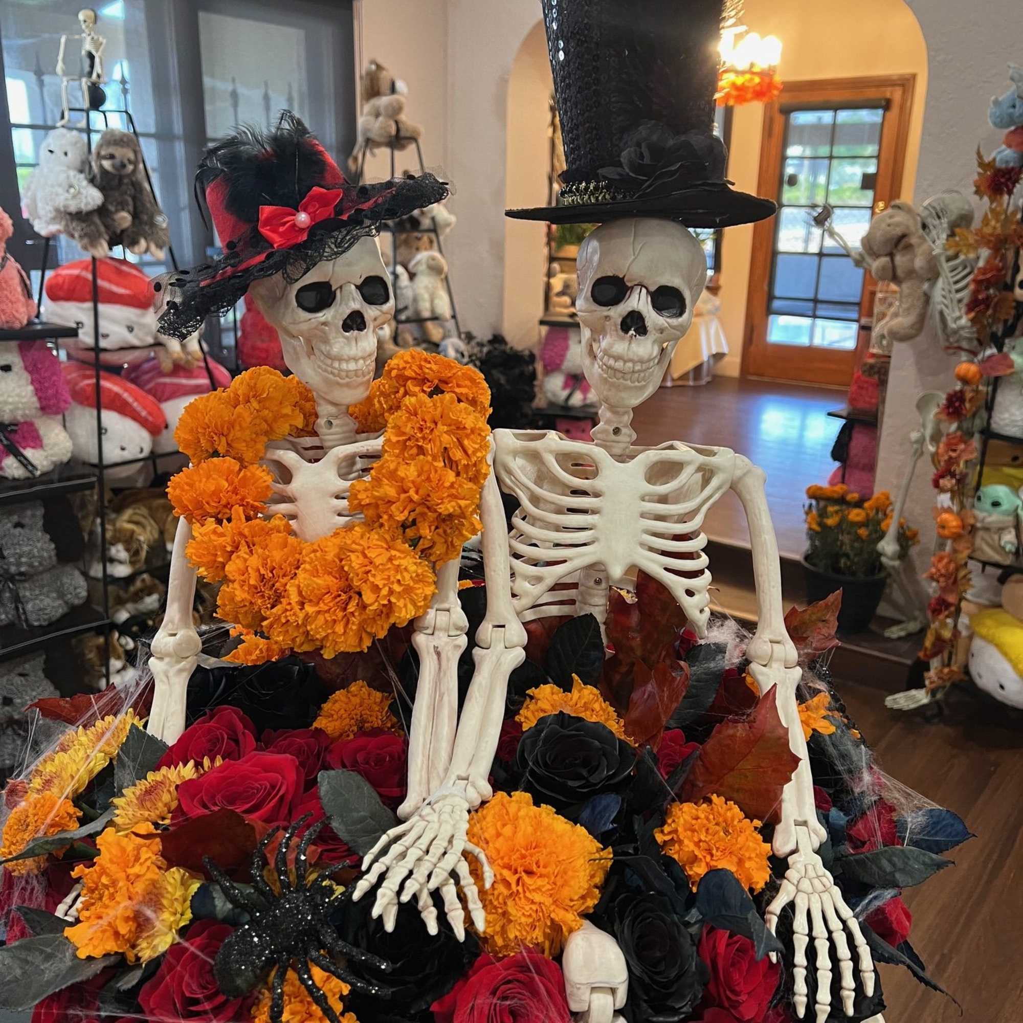Where passion meets the paranormal. This striking Halloween arrangement overflows with red