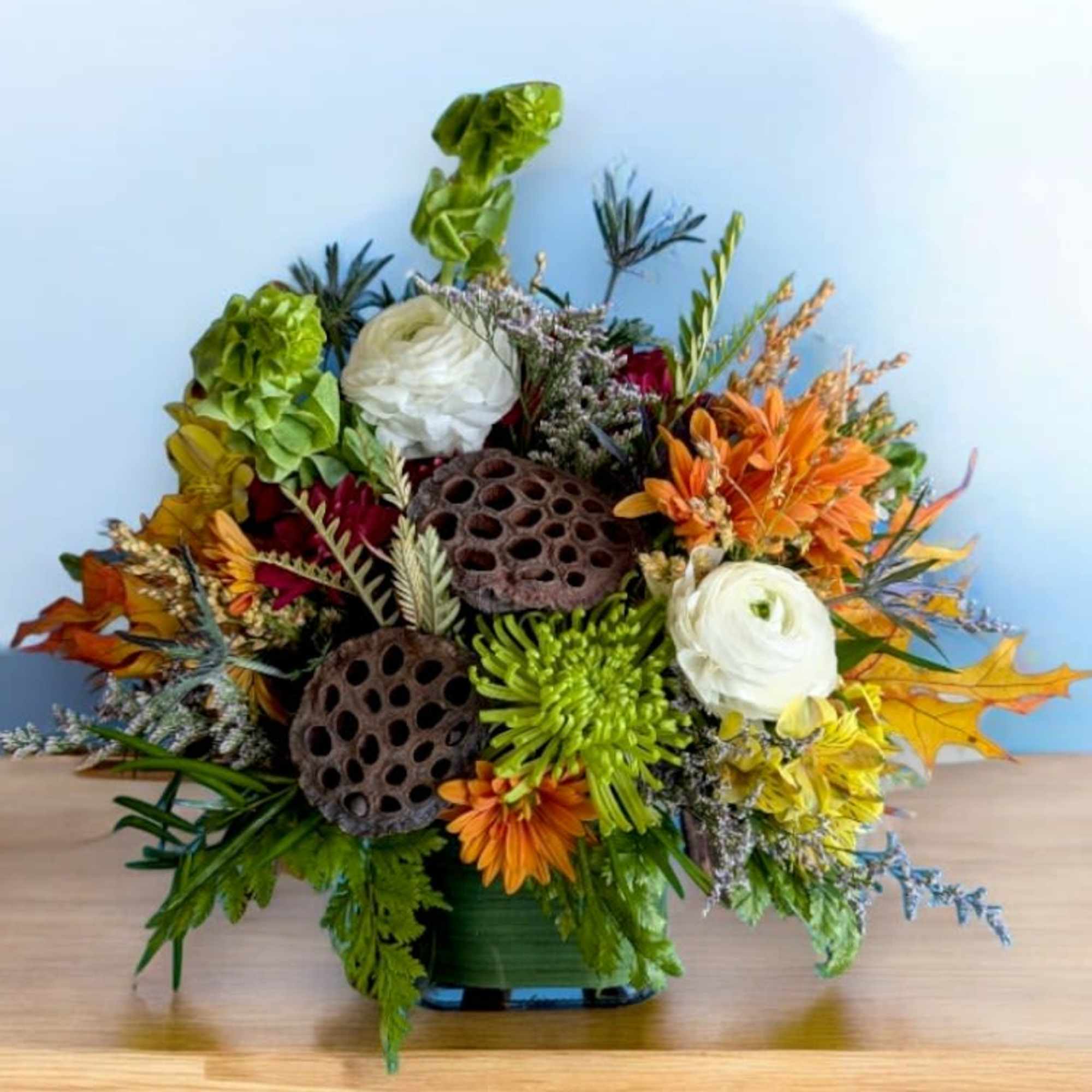 This arrangement is filled with all the bright wishes of the season.
