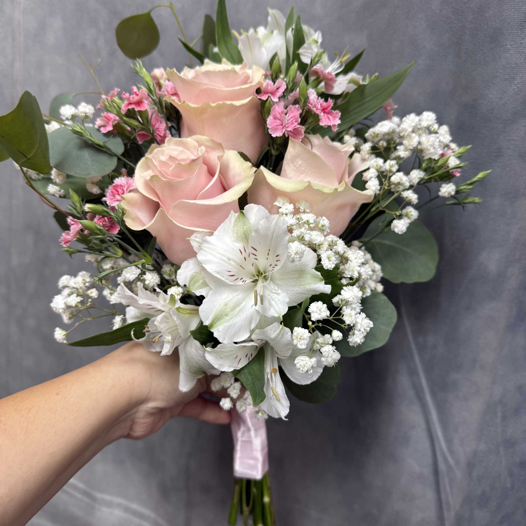 Shades of pink prom bouquet with pink roses , whit alstroemeria and