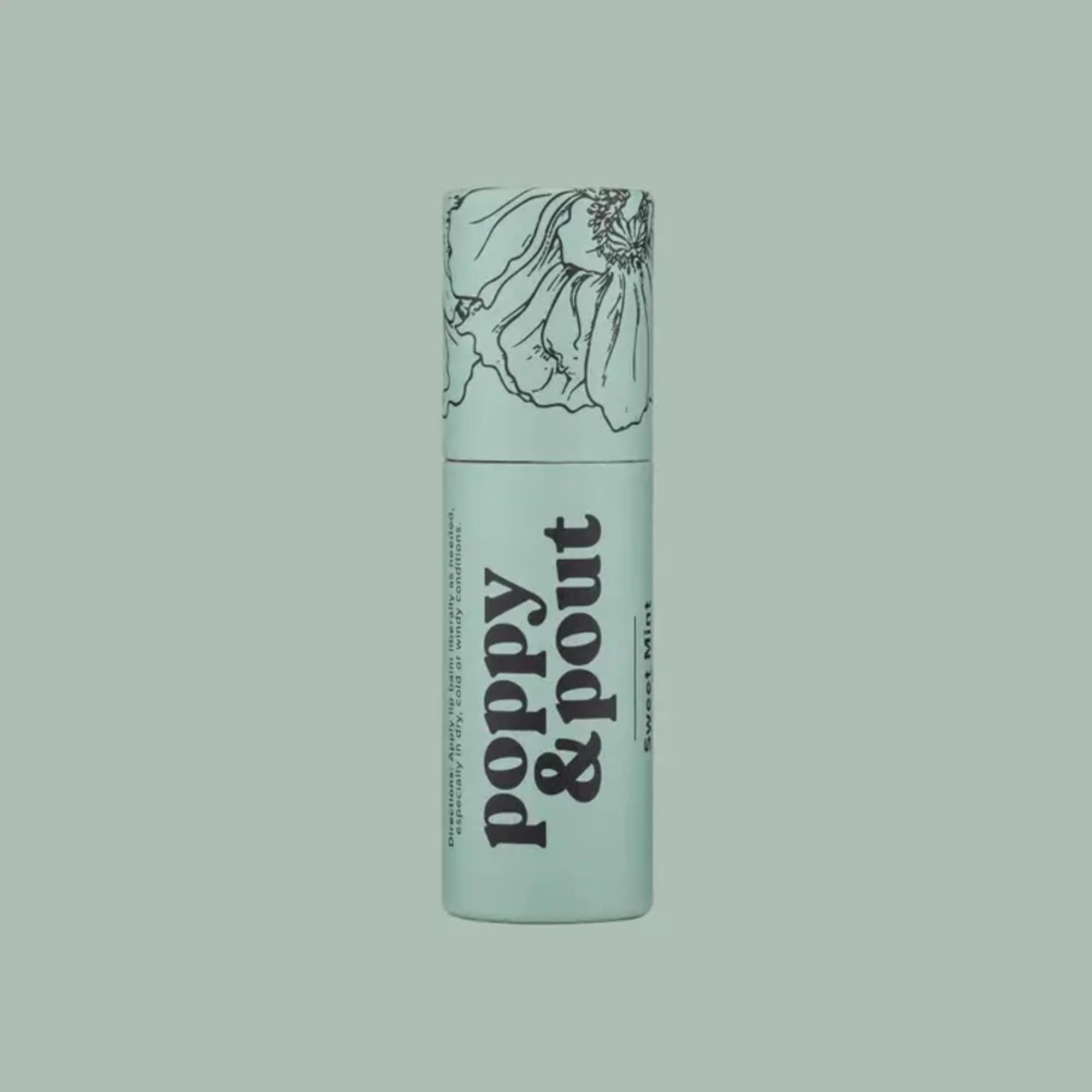 Mint-green lip balm tube with floral line art and bold text