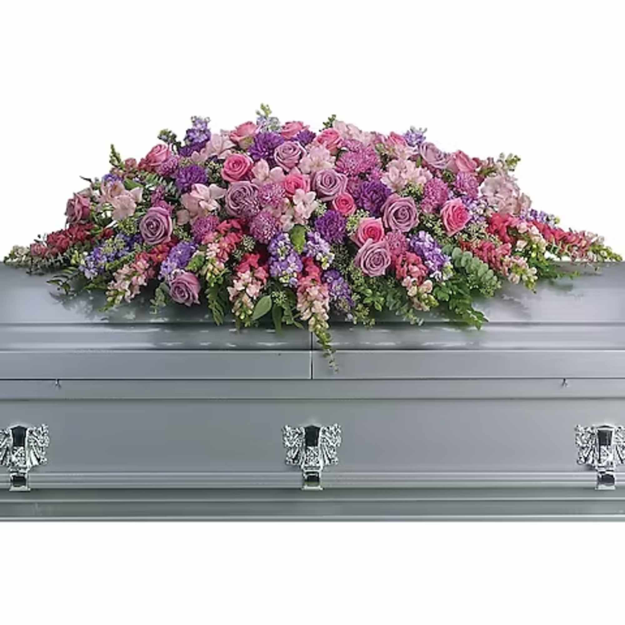 Lavender and pink floral casket spray on a gray casket