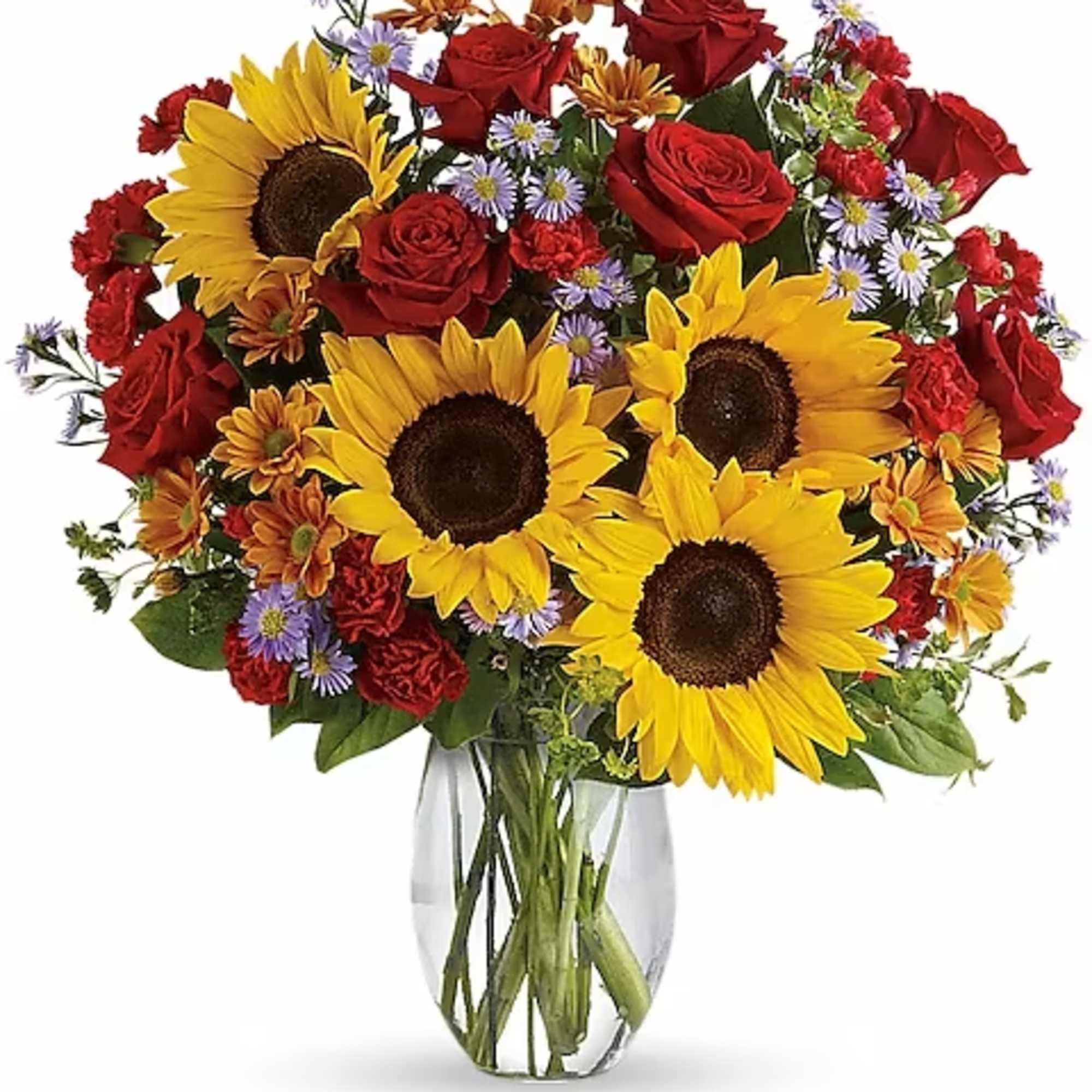 Bouquet of sunflowers, red roses, and small purple flowers in a clear vase