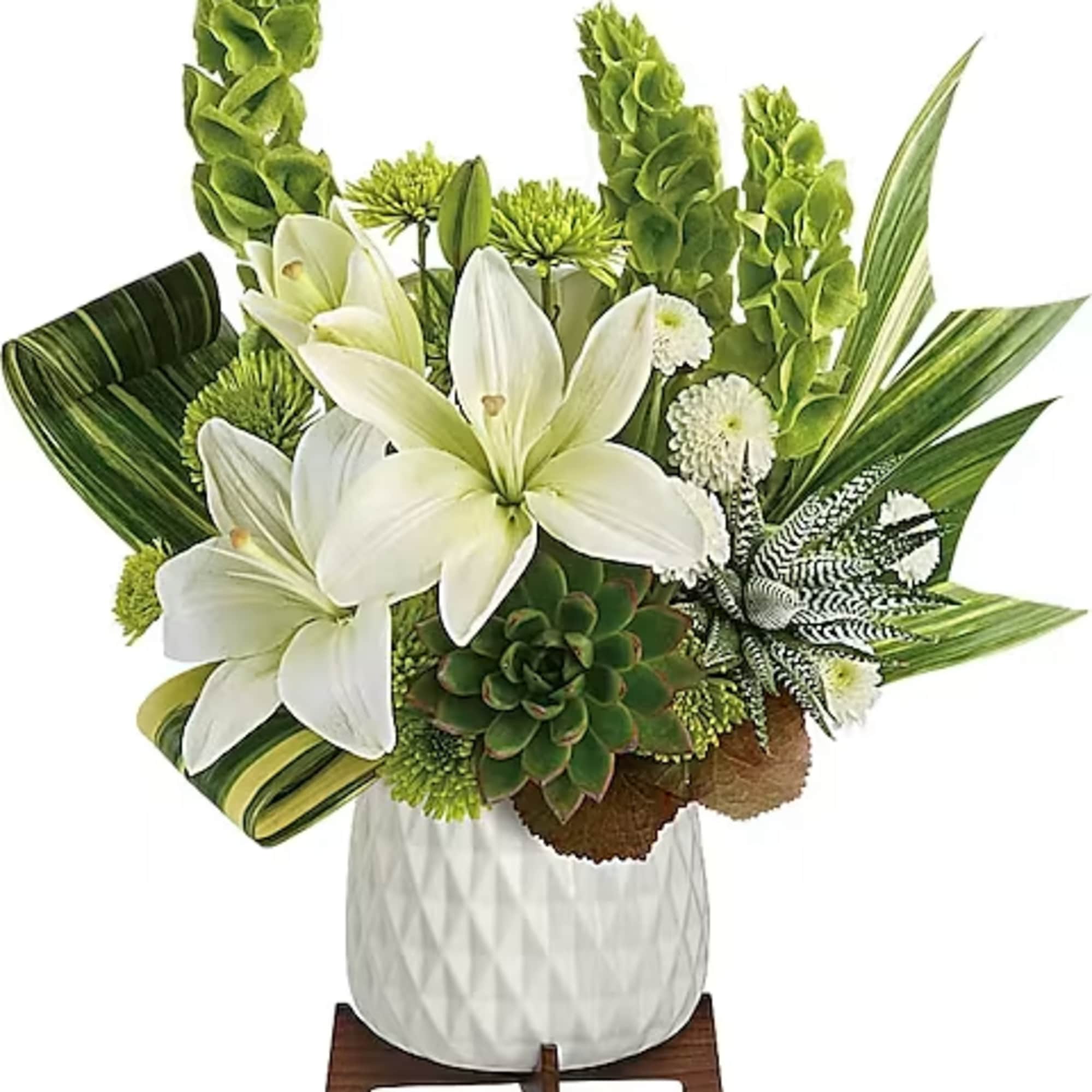 White lilies and green blooms in a white vase