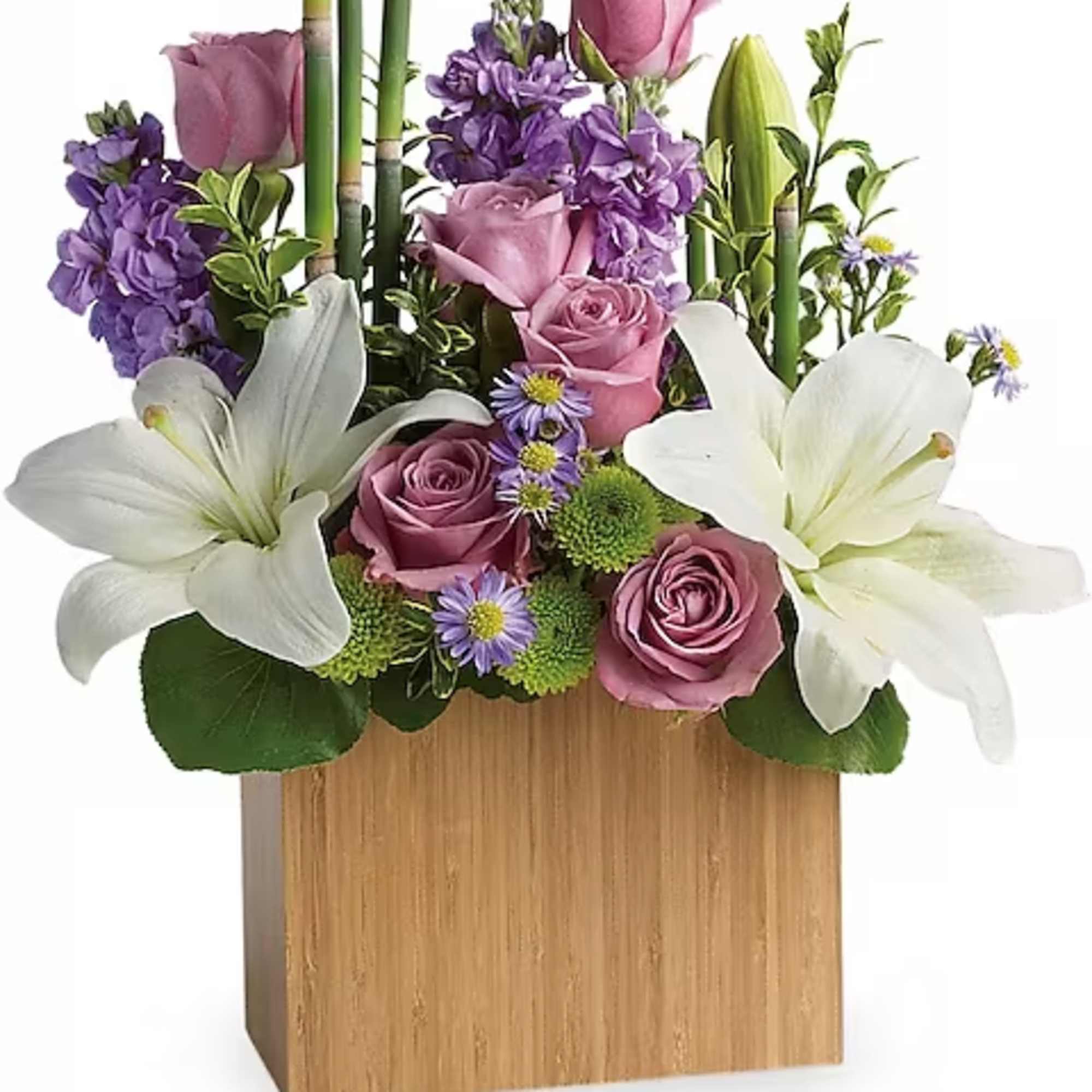 Pink roses and white lilies arranged in a wooden box with purple flowers