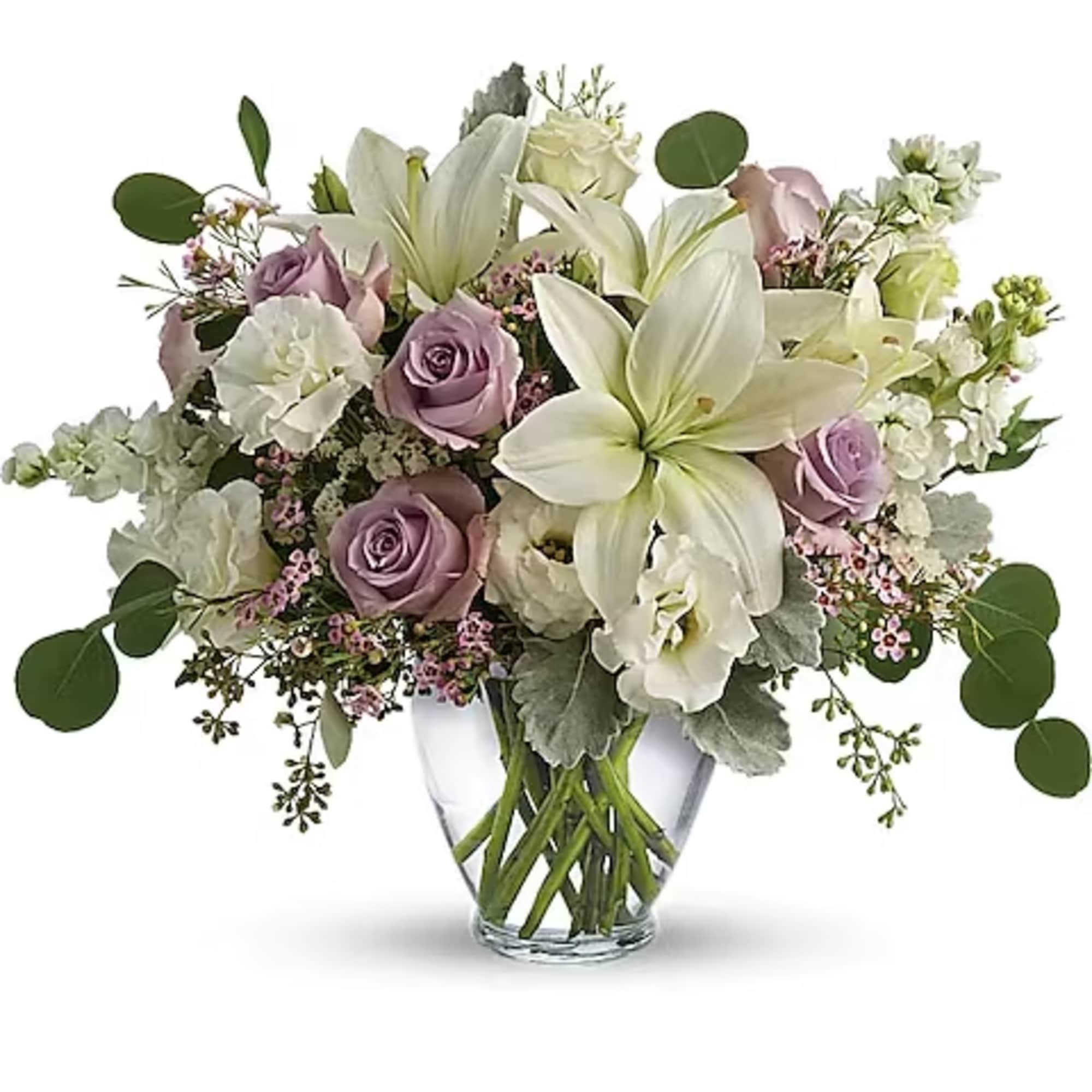 Lavender roses and white lilies in a clear glass vase