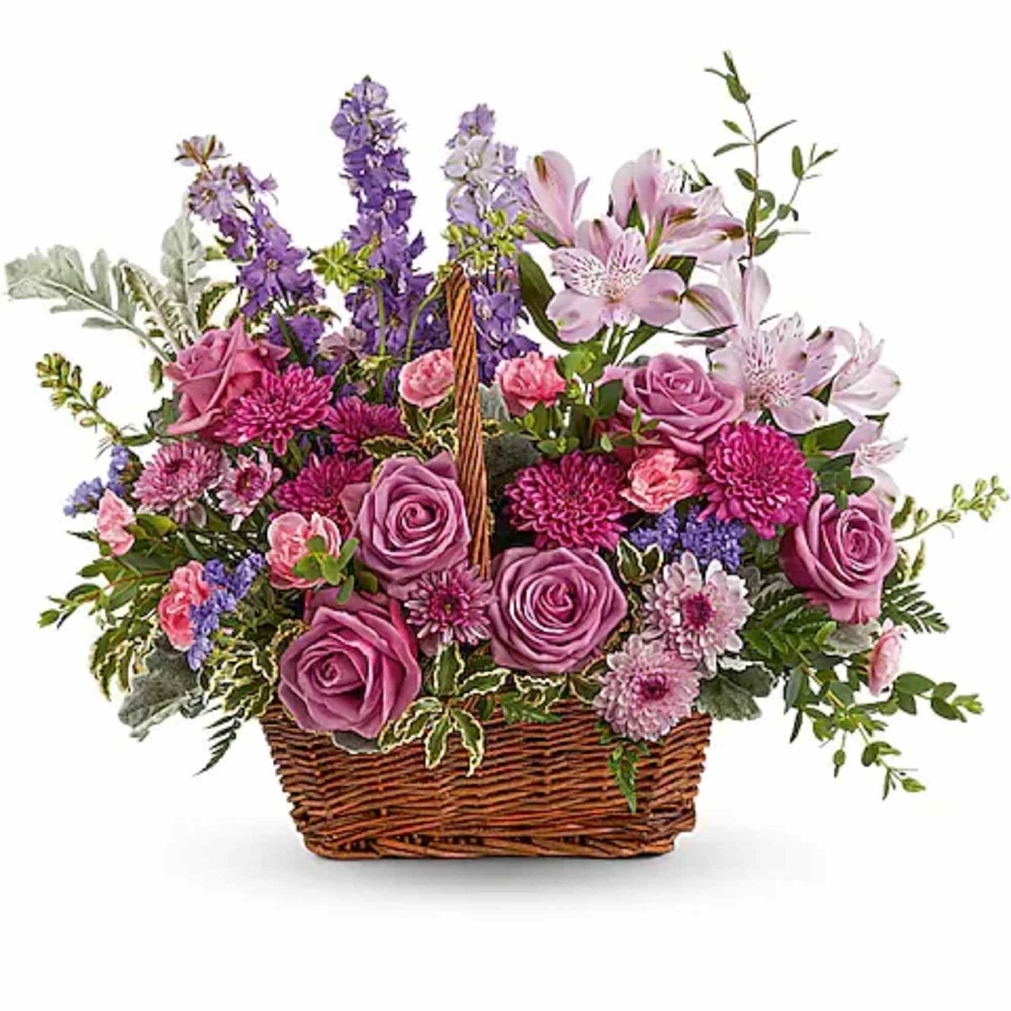 Basket arrangement of pink and purple flowers