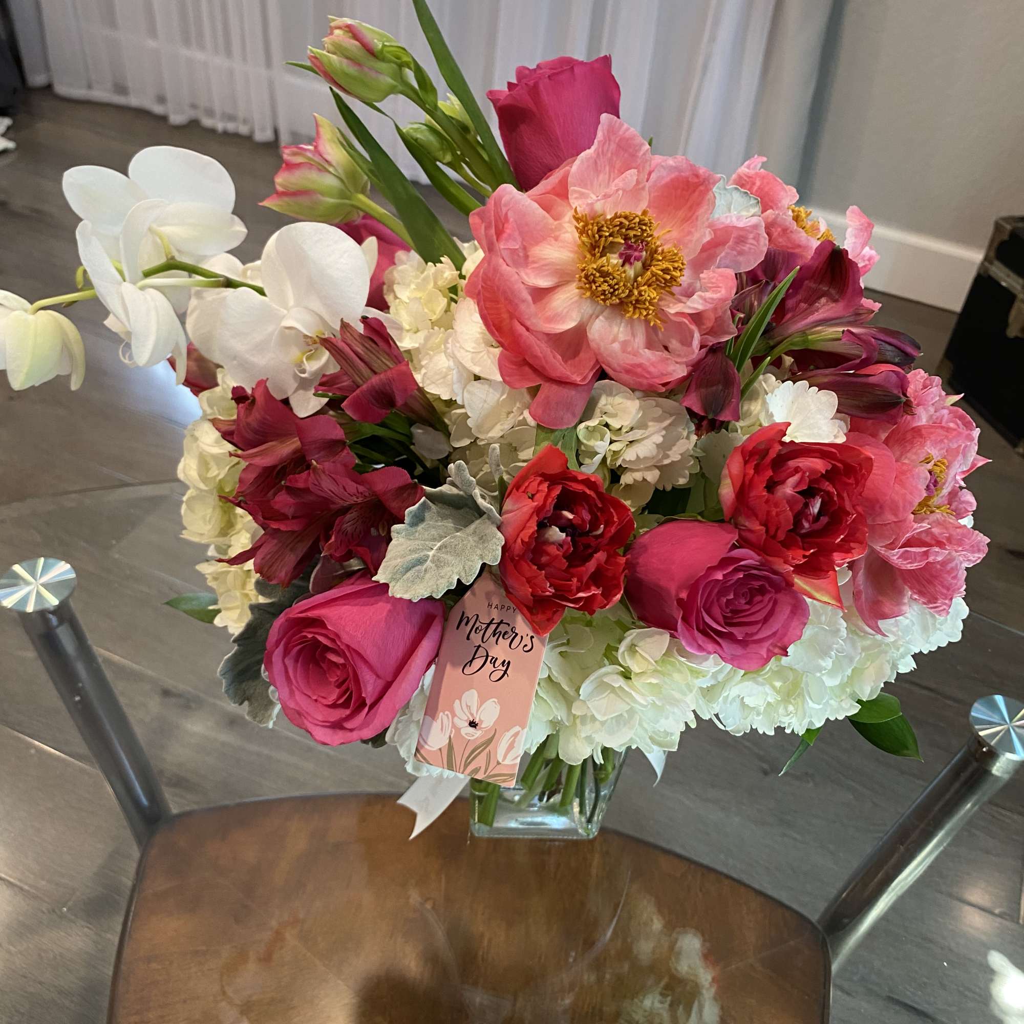 Pink and white mixed bouquet in a glass vase with a Mother's Day tag, photo 2 of 2