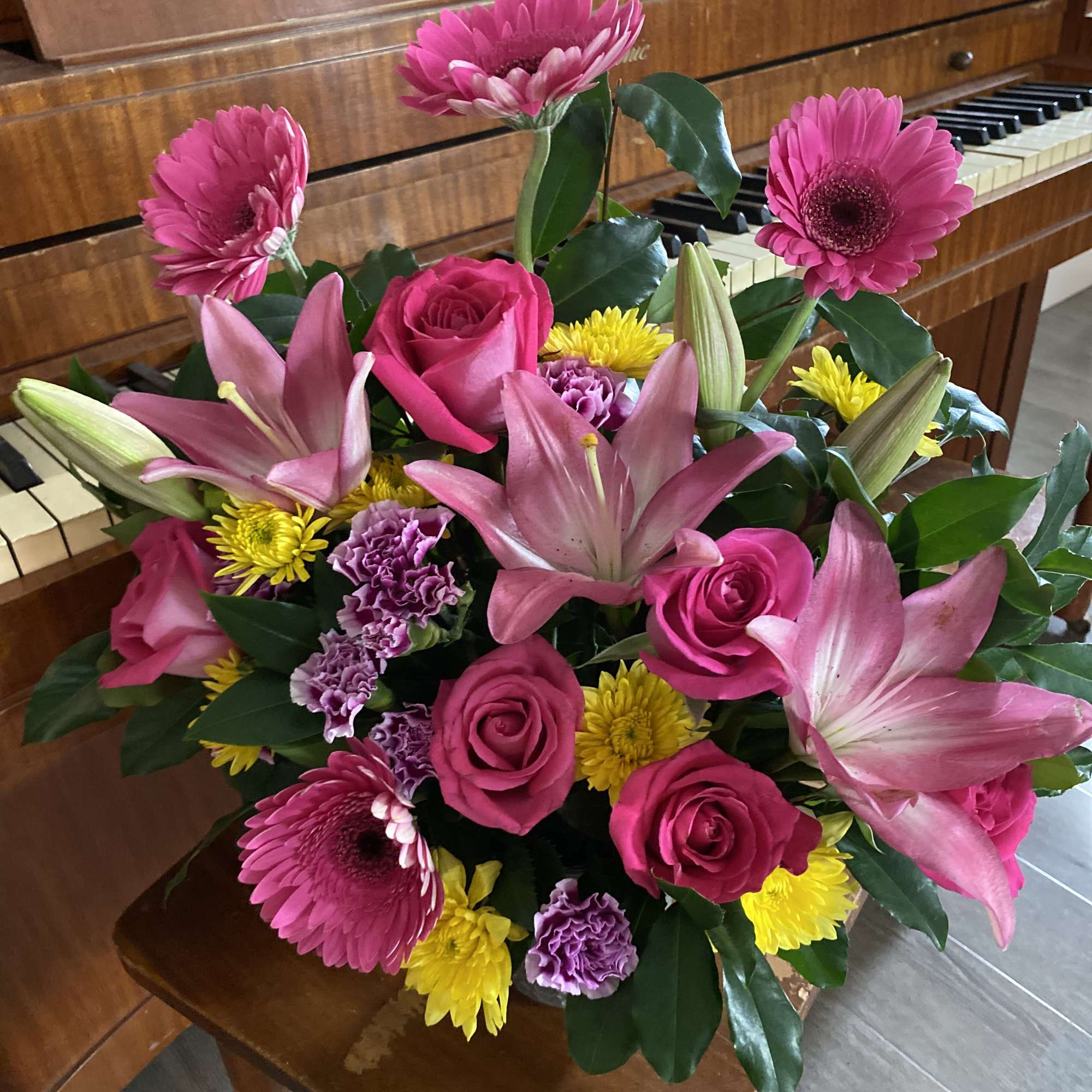 Bouquet of pink lilies, roses, gerbera daisies, and yellow chrysanthemums