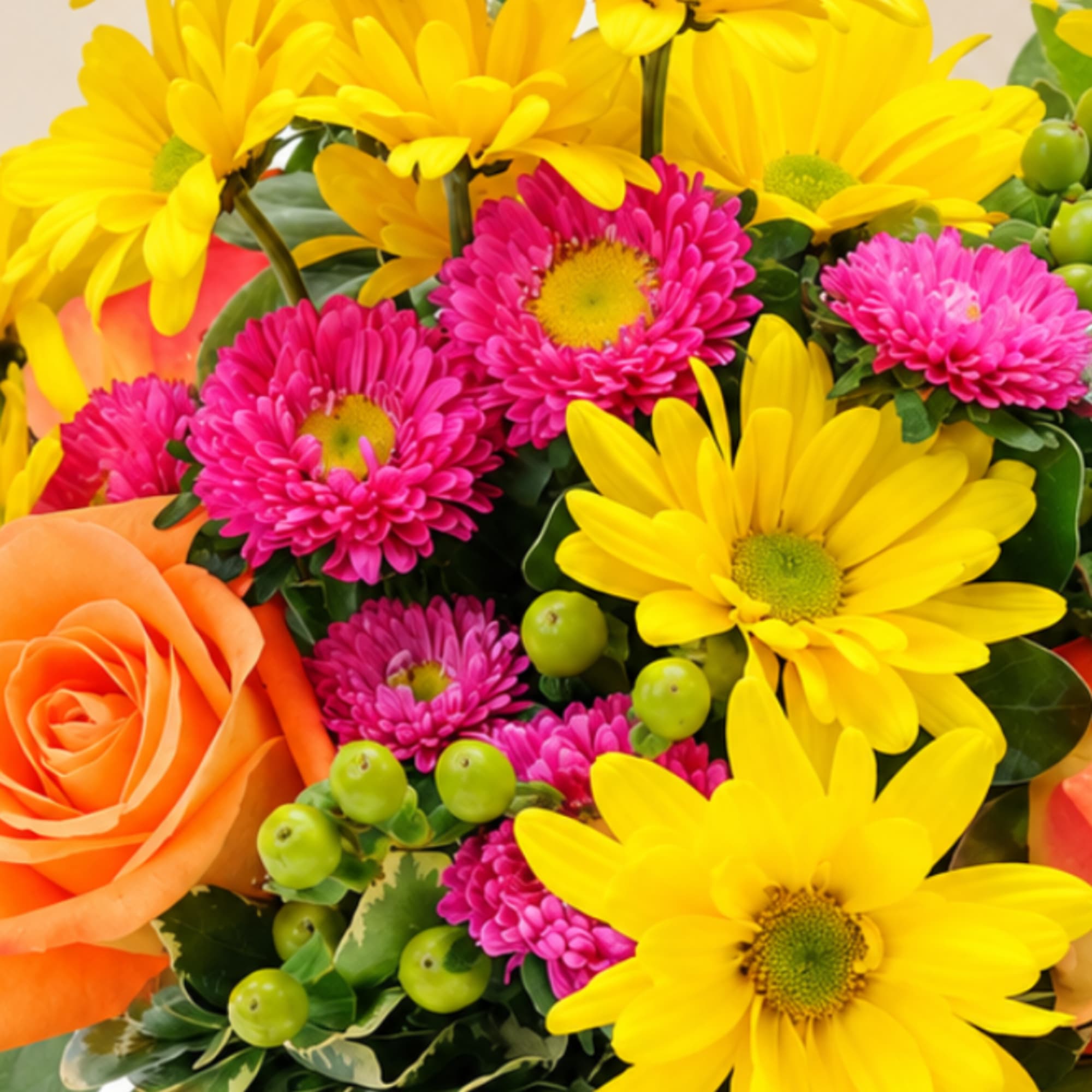 Bright bouquet of yellow daisies, pink mums, and an orange rose