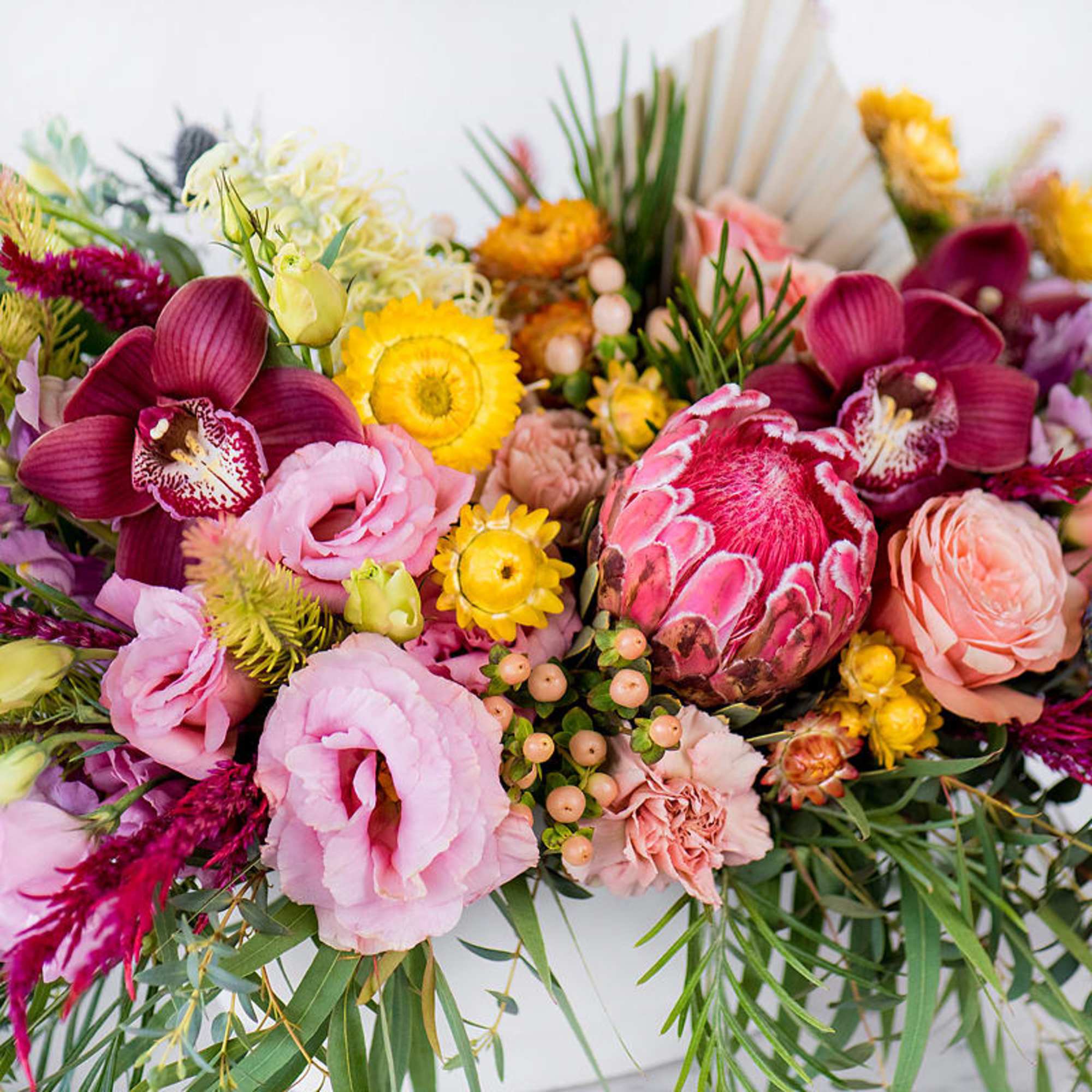 Our long and low arrangement features the best florals the season has, photo 2 of 4