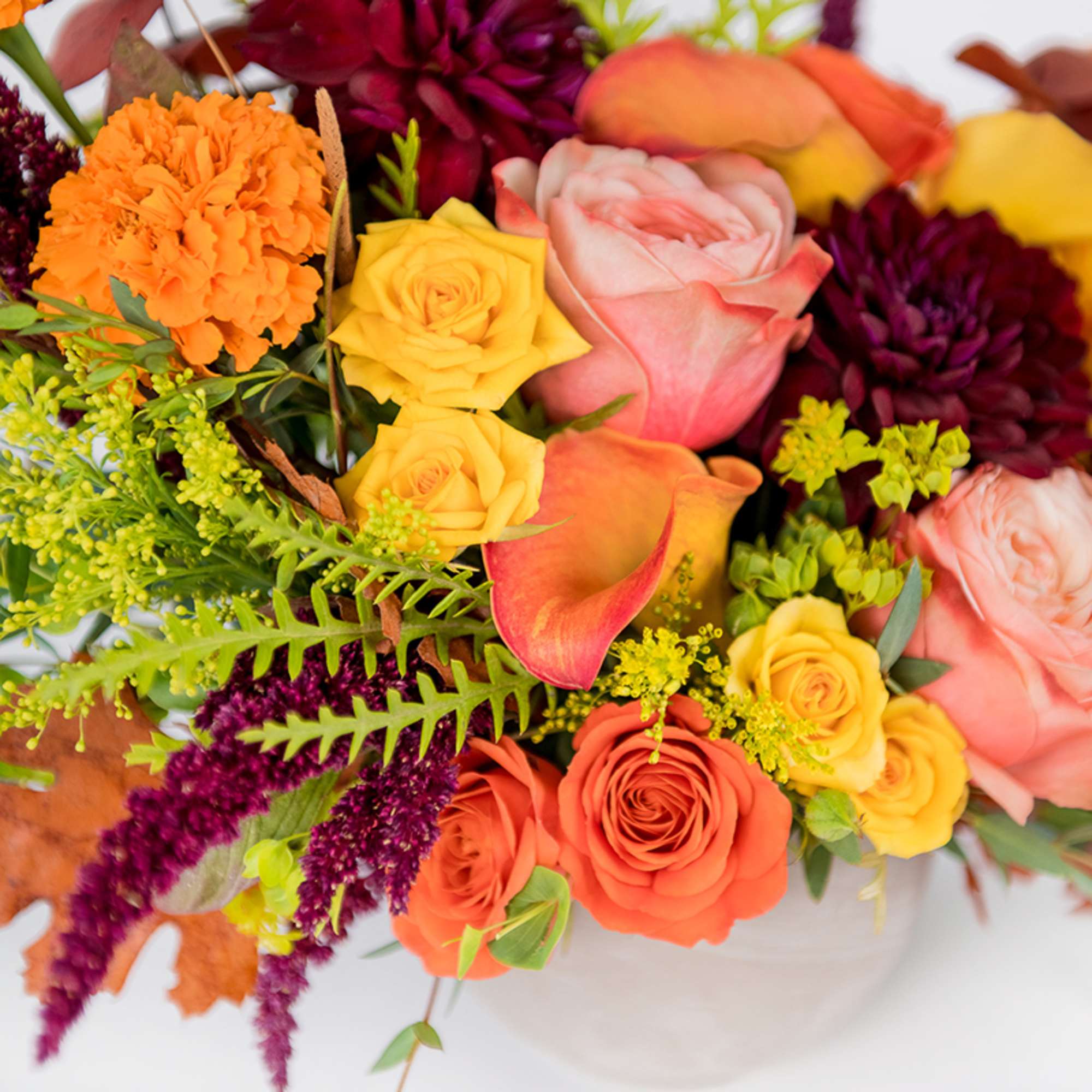 Our Fall Breeze arrangement showcases vibrant marigolds, roses, dahlias, and calla lilies, photo 3 of 4