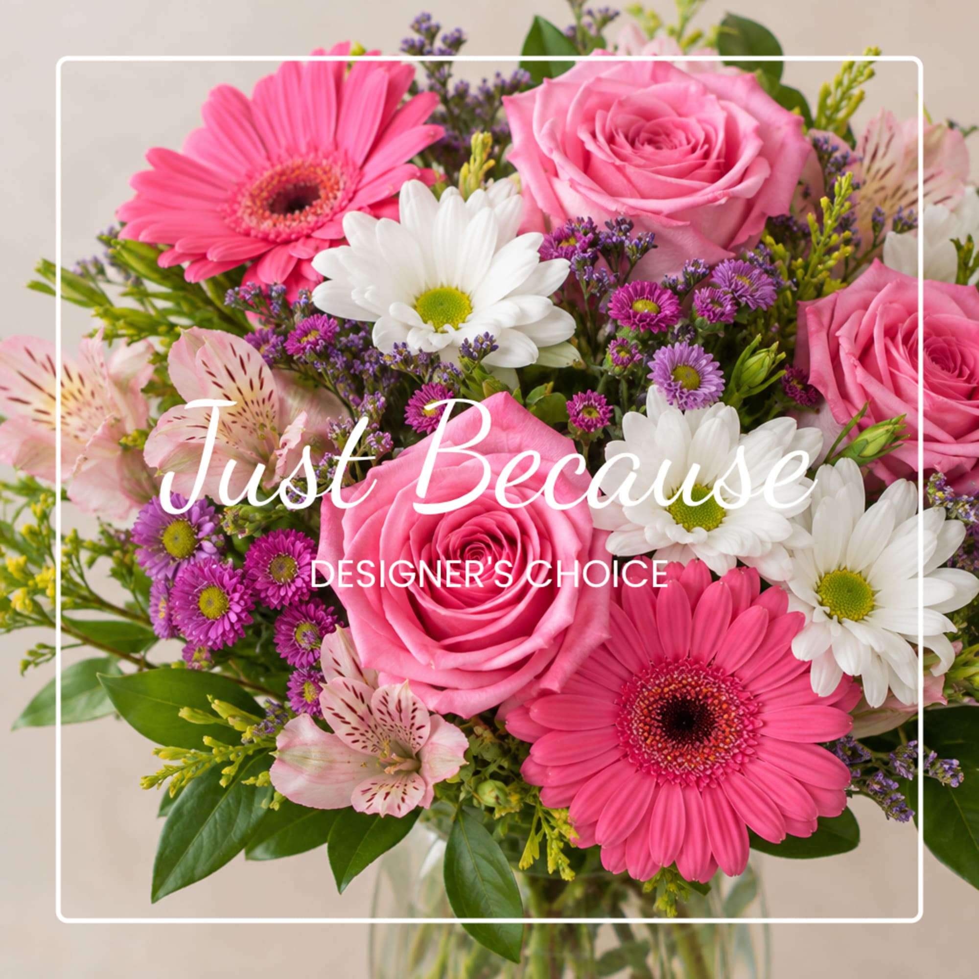 Pink roses and gerbera daisies with white daisies in a glass vase