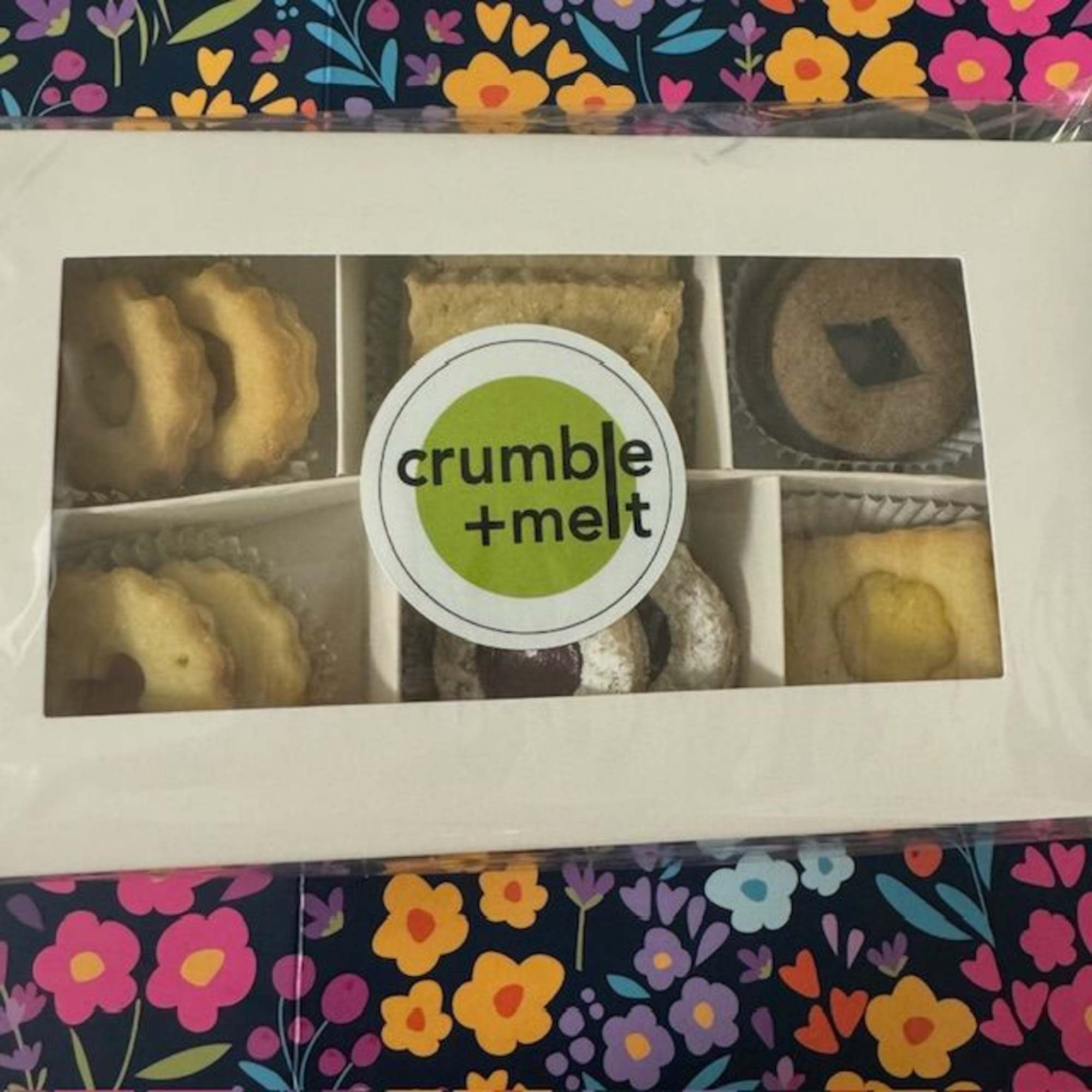 Box of assorted cookies with a crumble + melt label