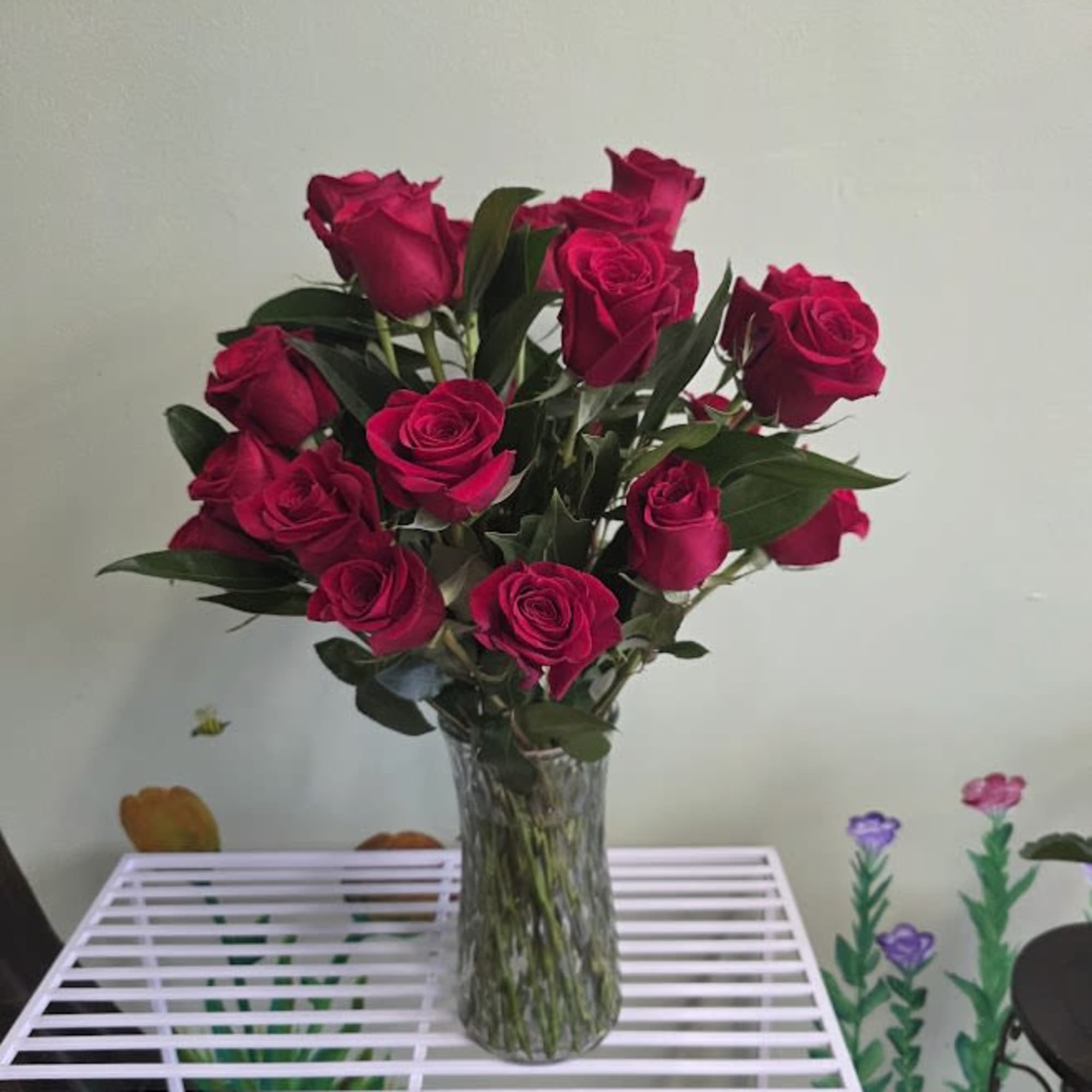 Bouquet of deep pink roses in a clear glass vase