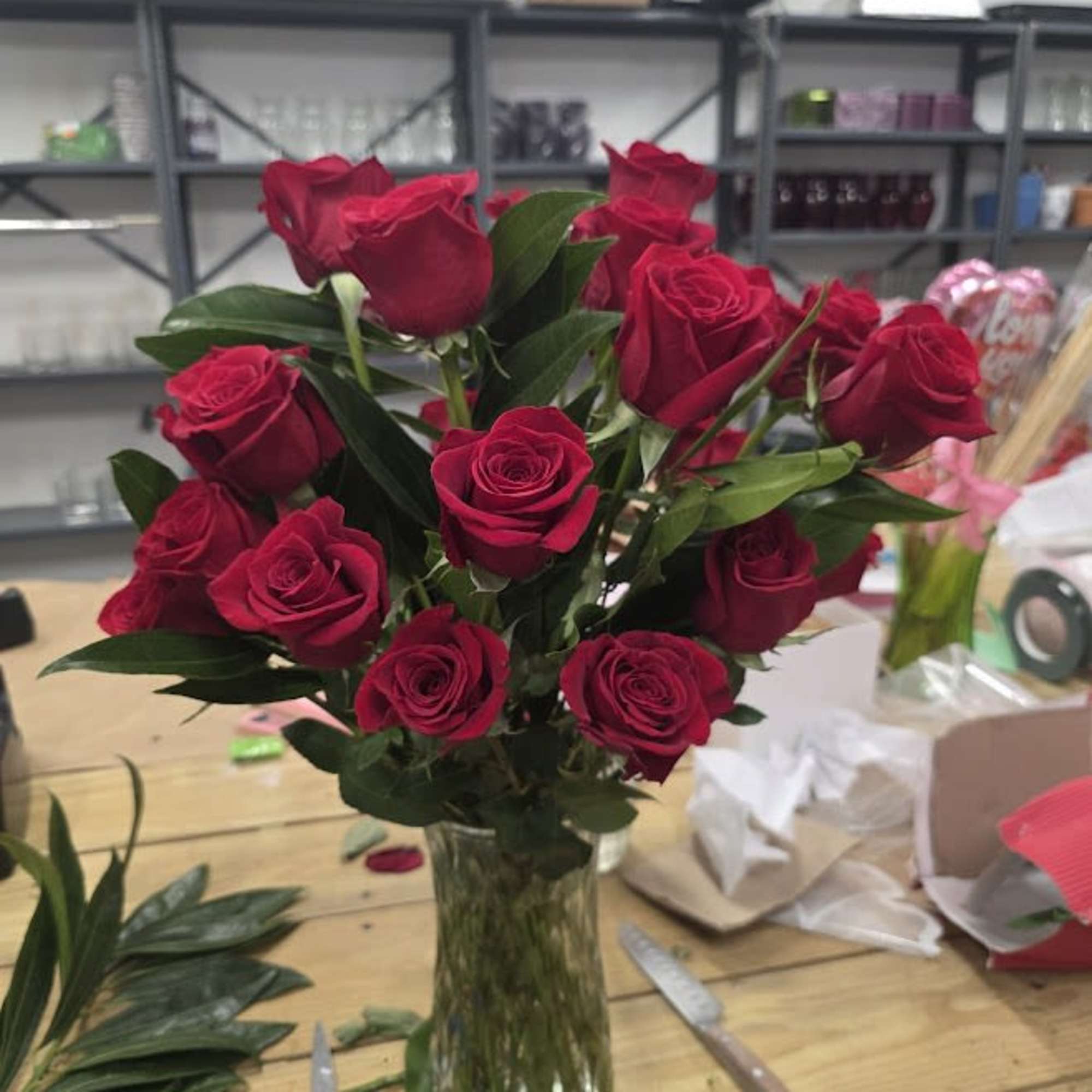 Bouquet of red roses in a clear glass vase