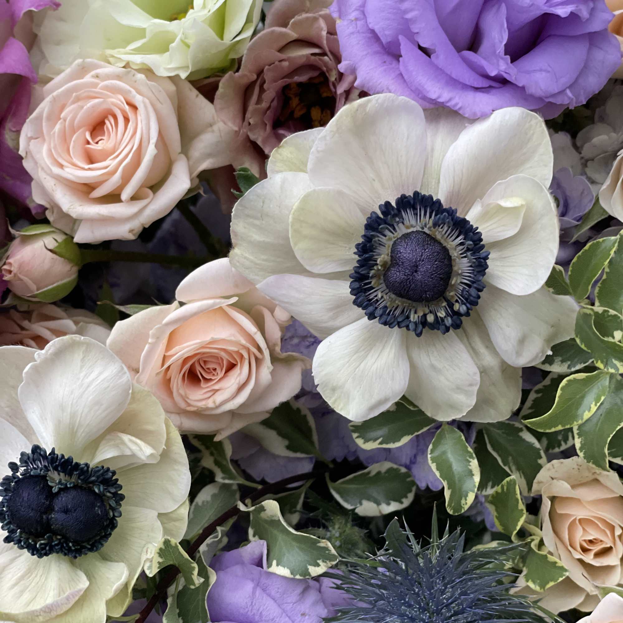Bouquet of lavender and blush flowers with white anemones