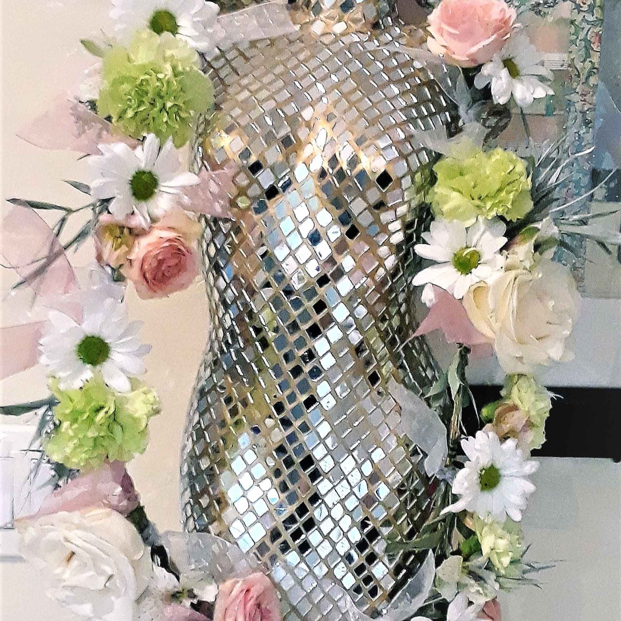 Floral garland with pink roses, white daisies, and green blooms around a mirrored dress form