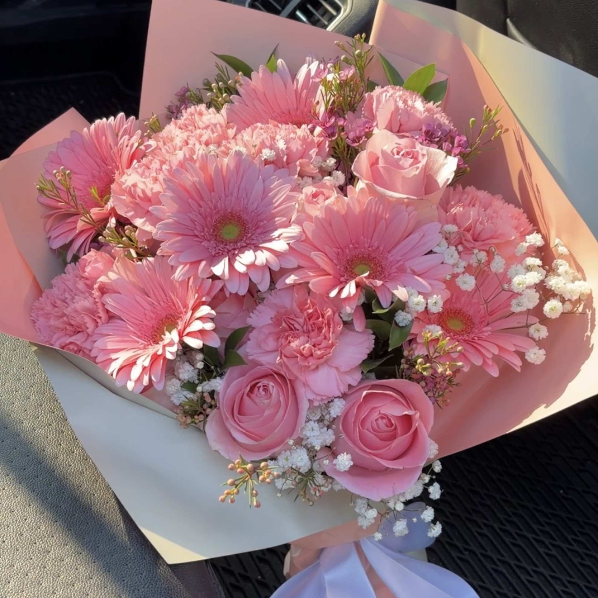 Pink bouquet with gerbera daisies and roses wrapped in pastel paper, photo 3 of 3