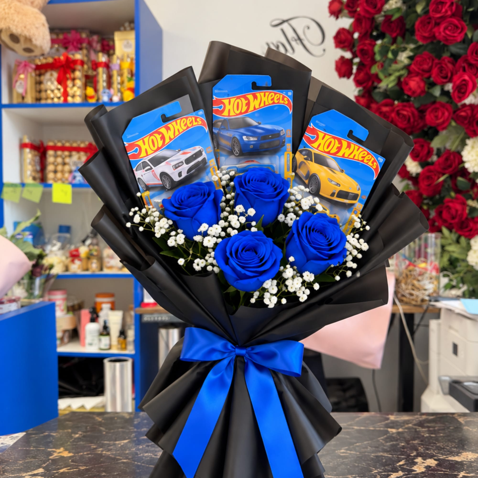 Bouquet of blue roses with Hot Wheels toy car packages