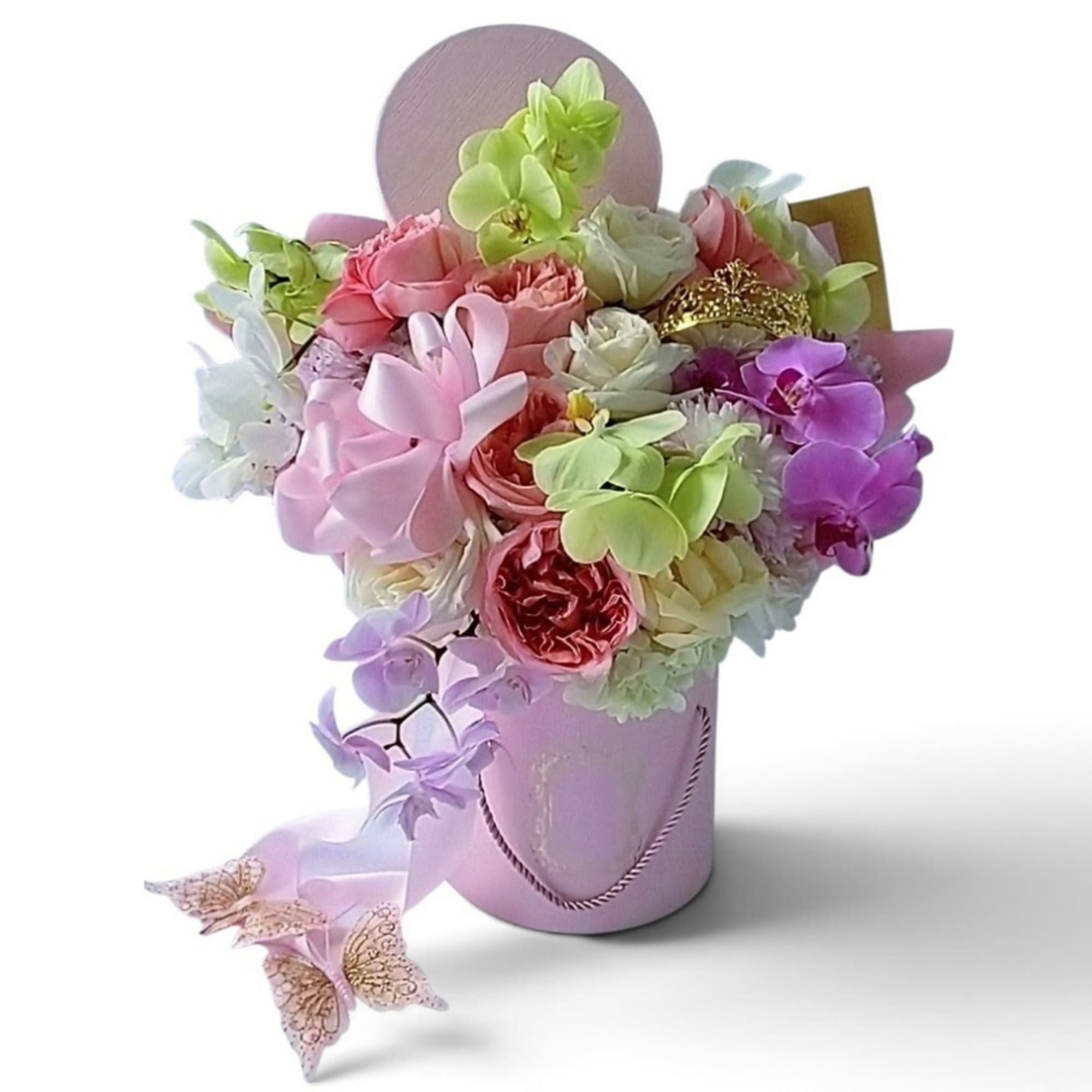 Pastel bouquet of mixed flowers in a pink hatbox with butterfly accents
