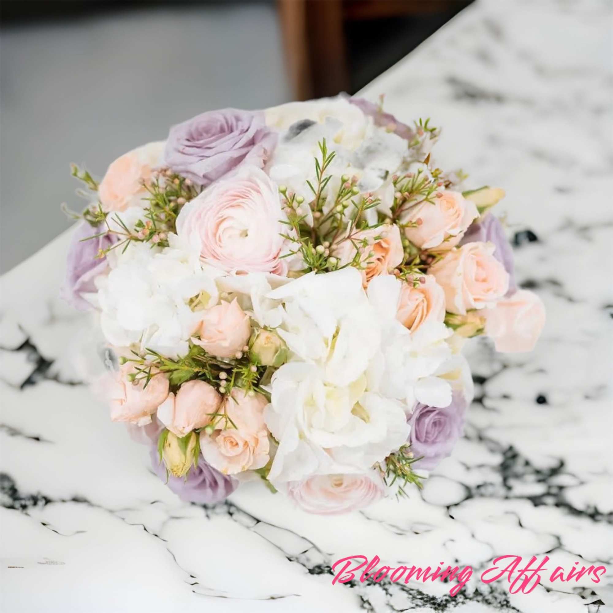 Pastel bouquet of roses, ranunculus, and white blooms