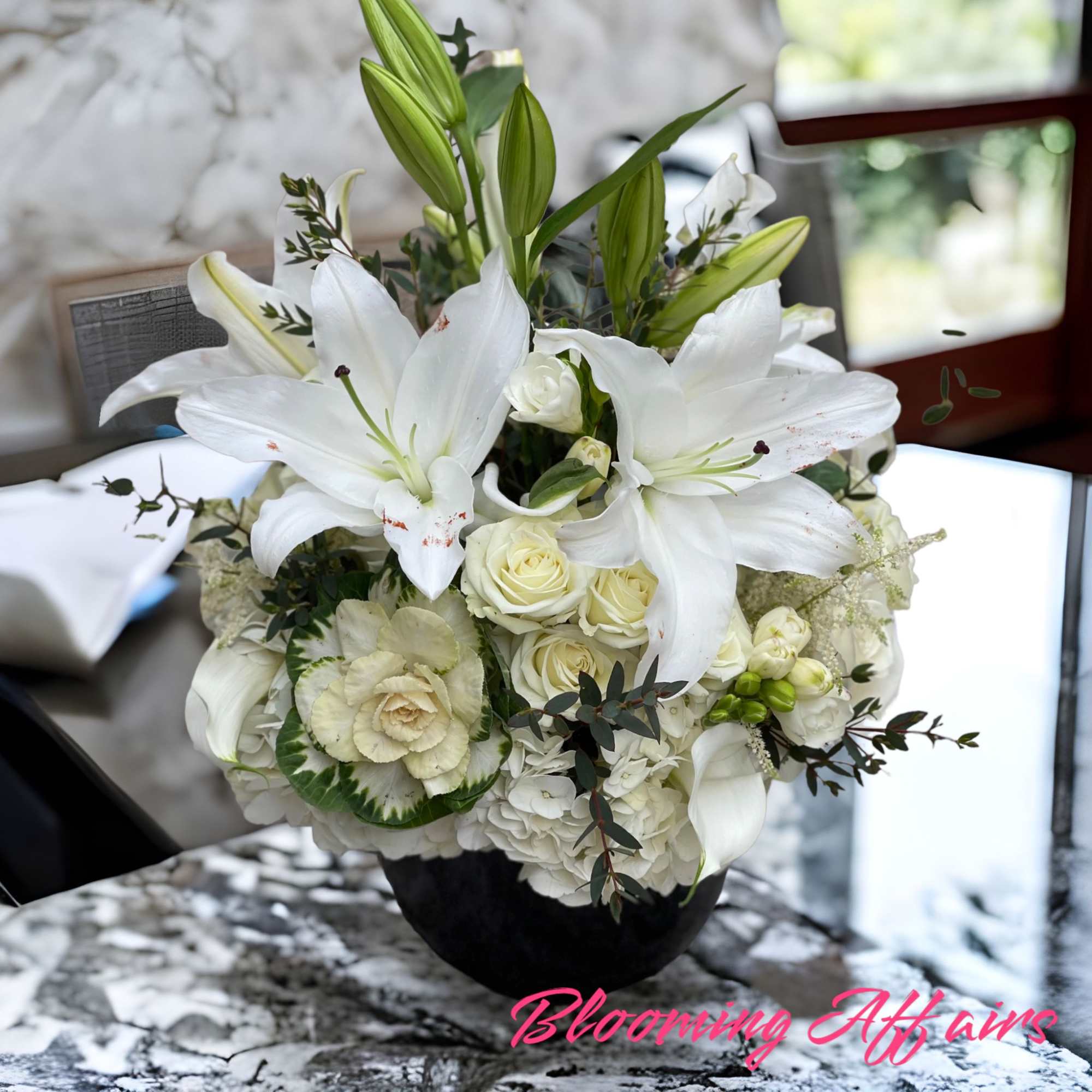 White lilies and roses arranged in a black vase, photo 2 of 3