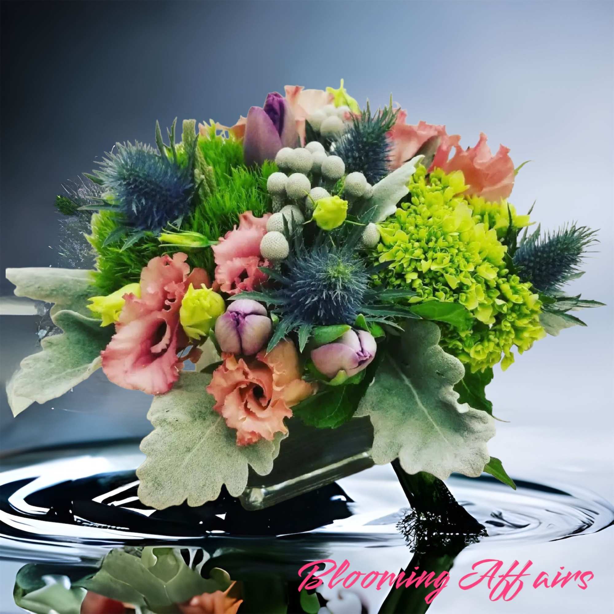 Bouquet of pink and green flowers with blue thistle-like blooms