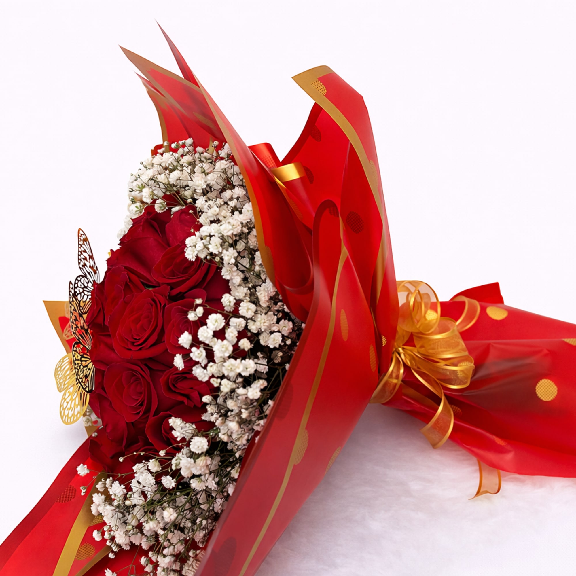 Bouquet of red roses with white baby's breath in red and gold wrap