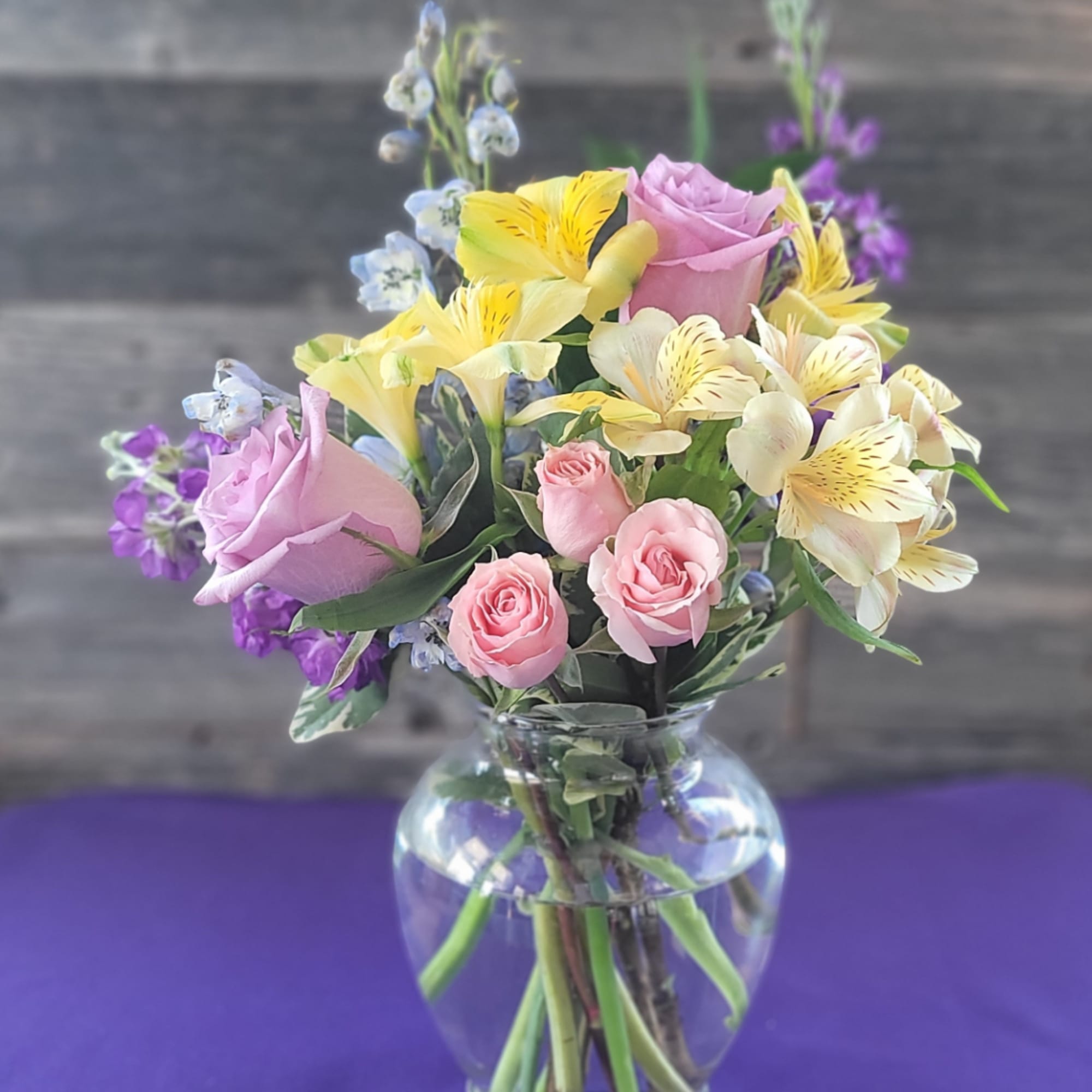 Mixed pastel bouquet in a clear glass vase