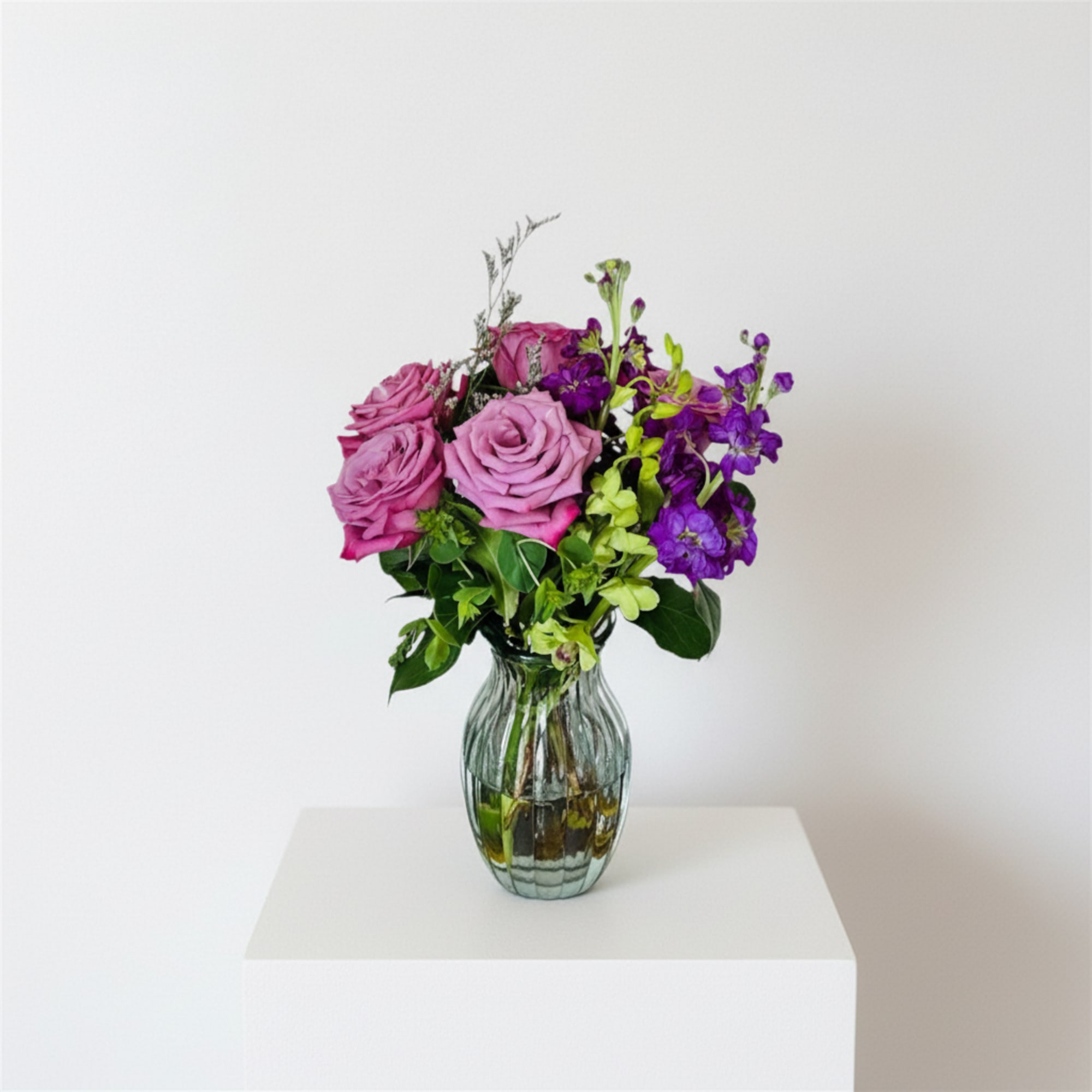 Soft lavender and rose-pink blooms mingle with deep purple accents in a