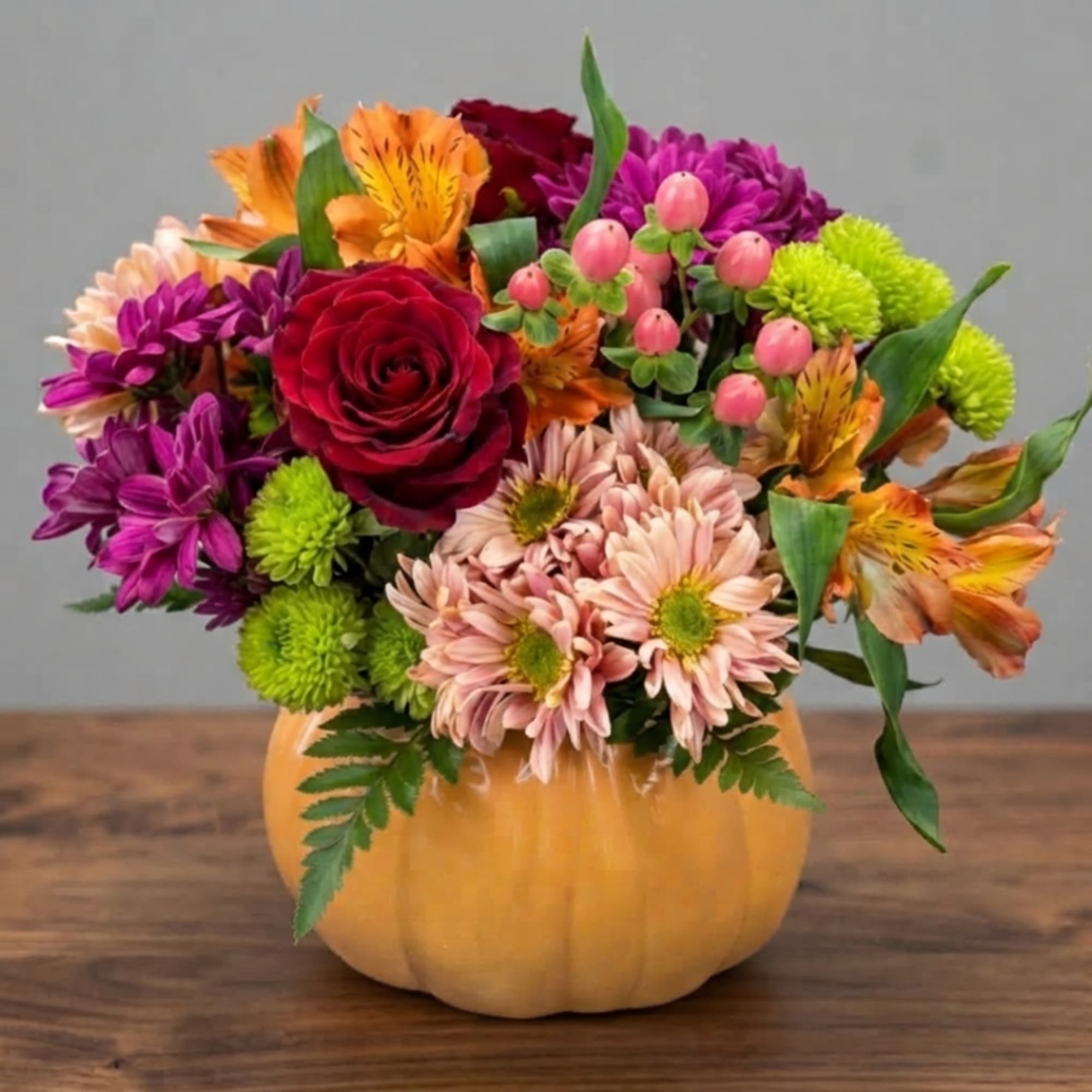 Mixed flower arrangement in a pumpkin-shaped container