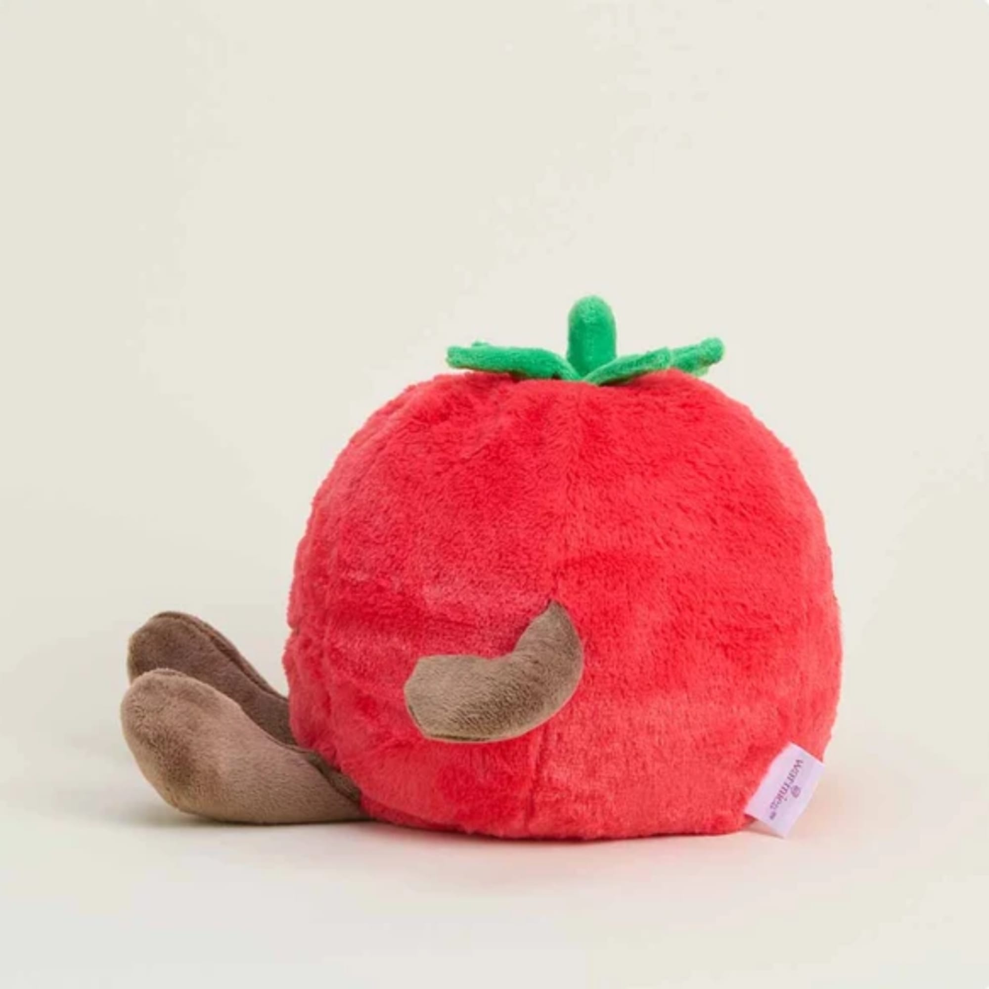 Plush red tomato-shaped toy with green top and brown feet
