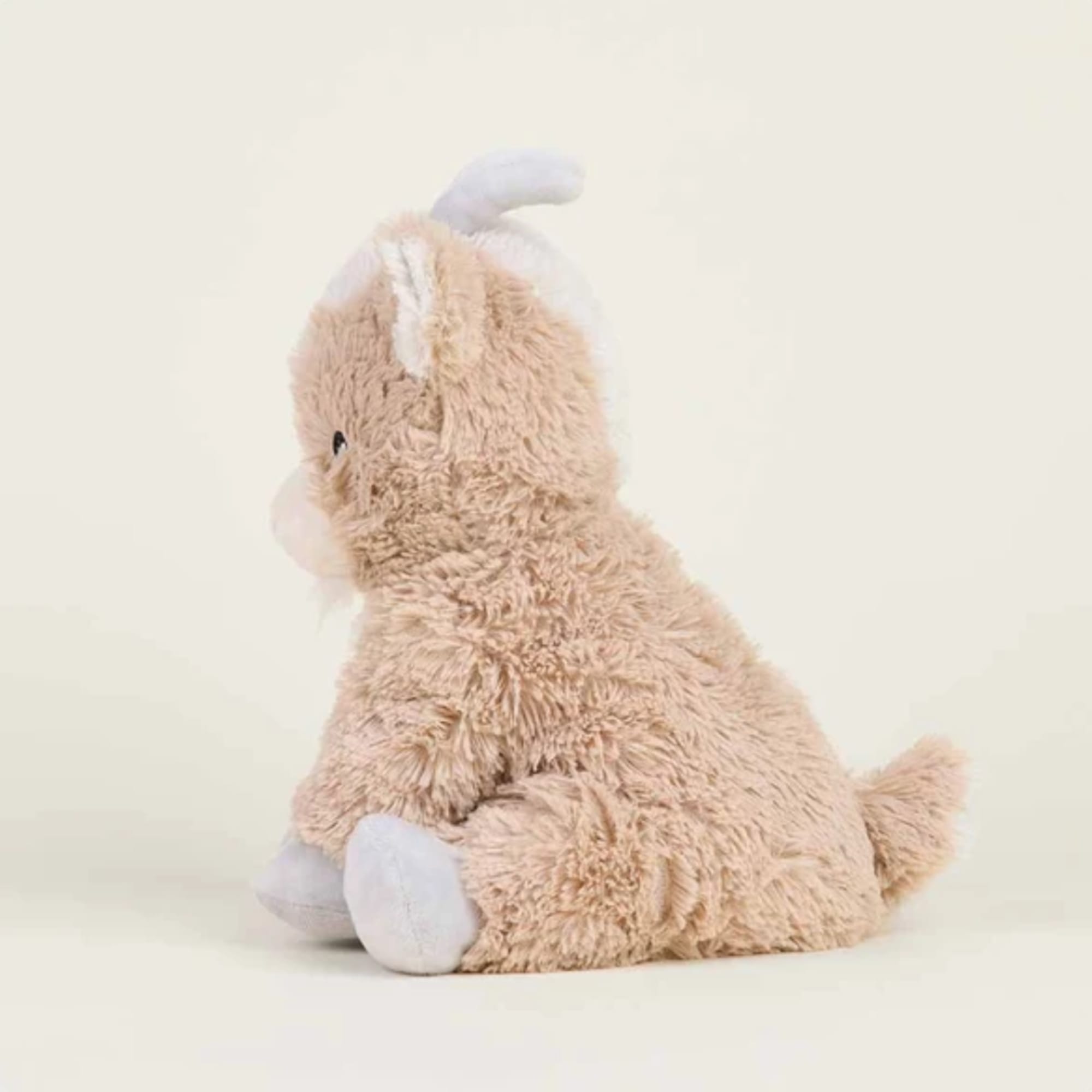 Plush bunny toy in beige and white